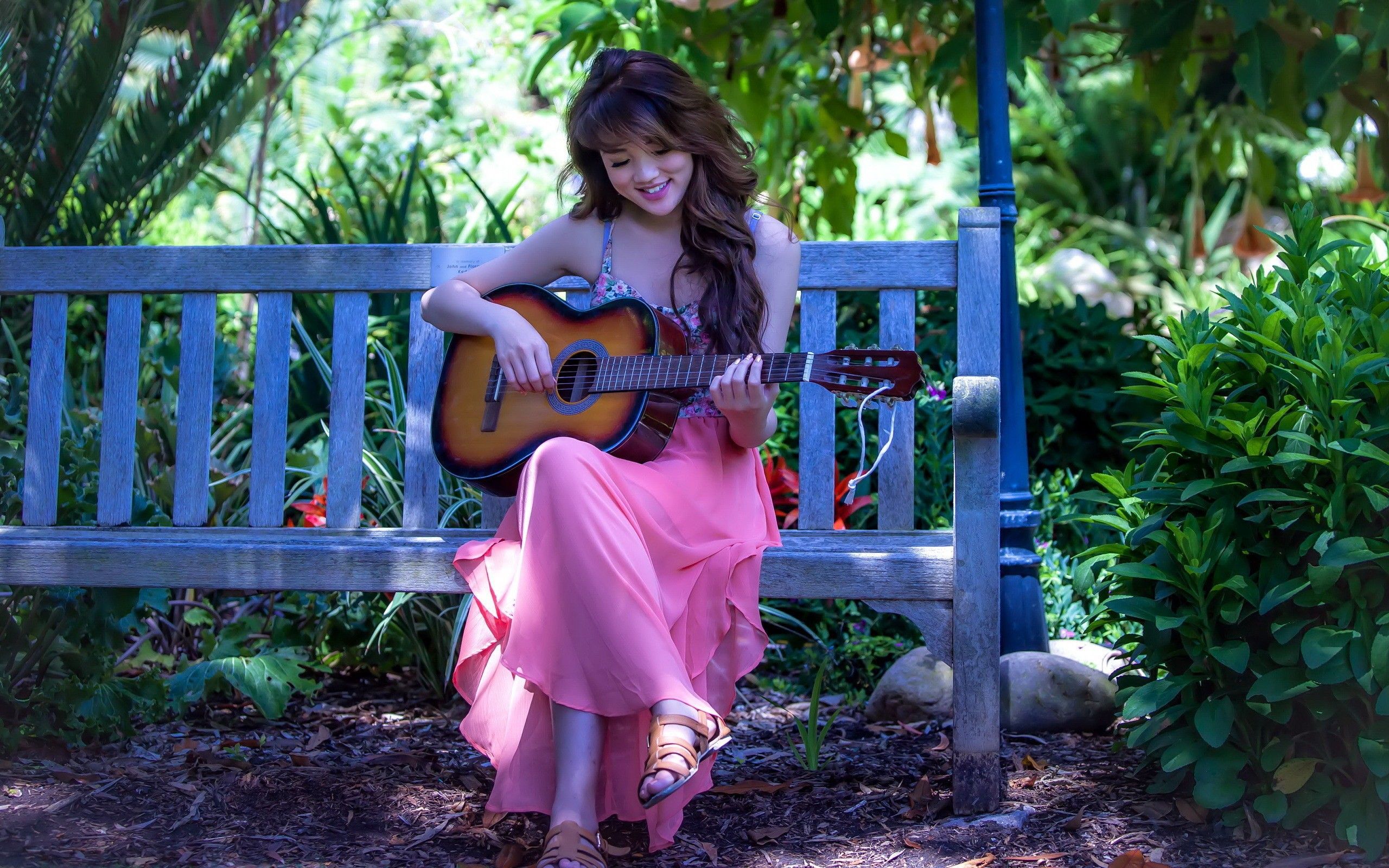 A Girl Sits On A Bench In The Garden And Playing Guitar Image With Cute Girl