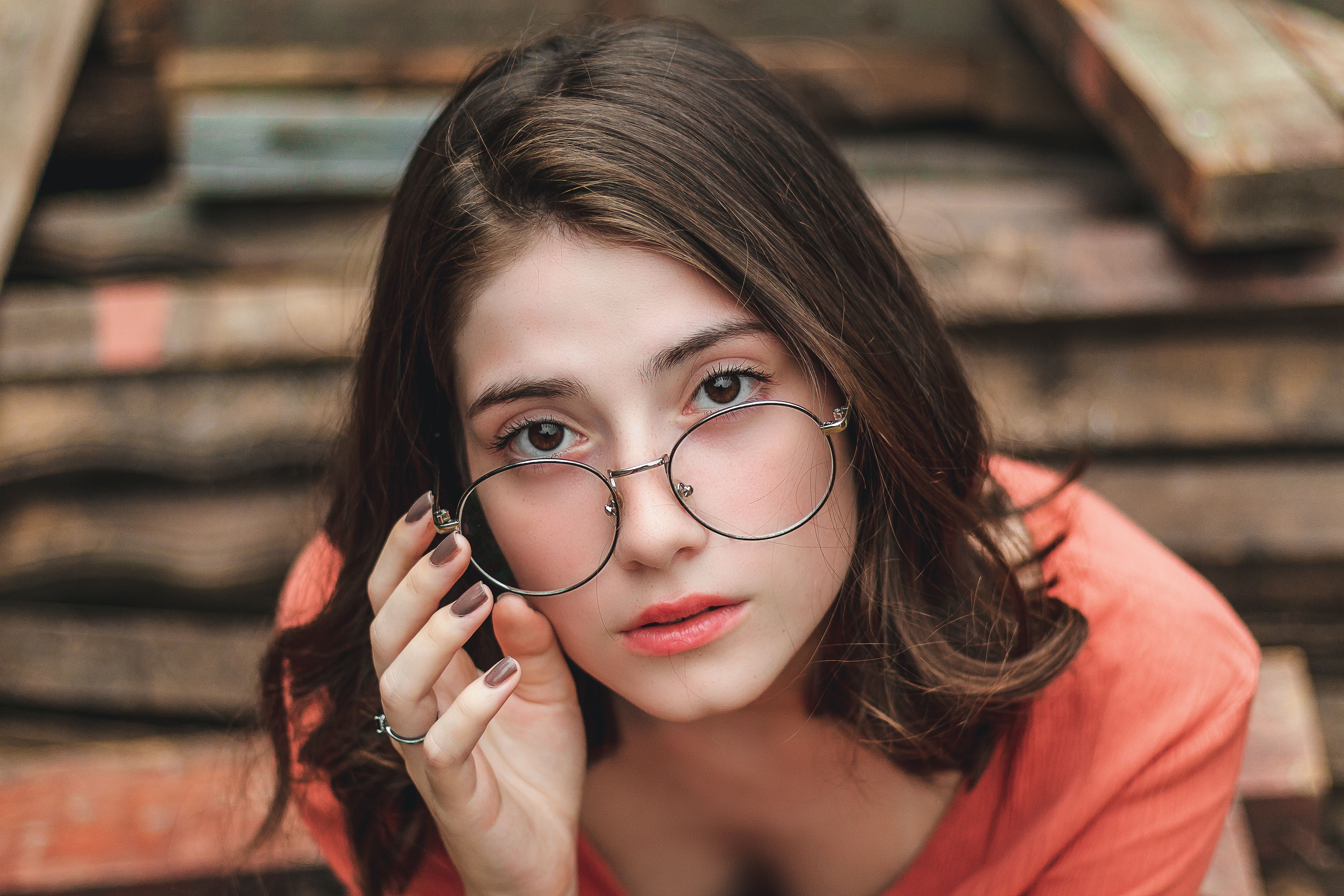 Sitting Woman Wearing Eyeglasses · Free