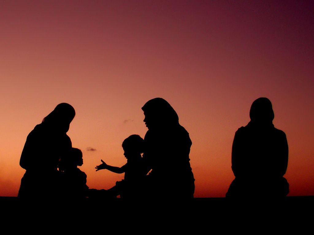 Muslim Family In Sunset