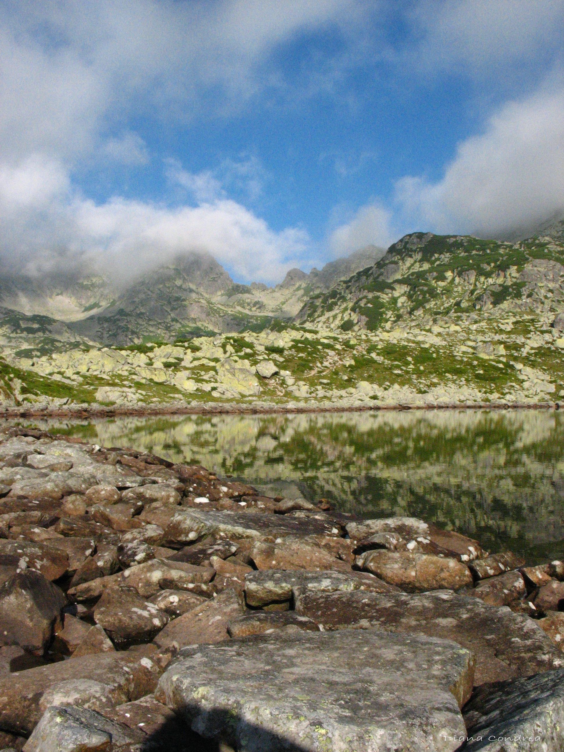 cliffs reflecting the largest glacial lake of Romania, lake Bucura, in Retezat National Park photo by Dia. Nature adventure, National park photo, National parks