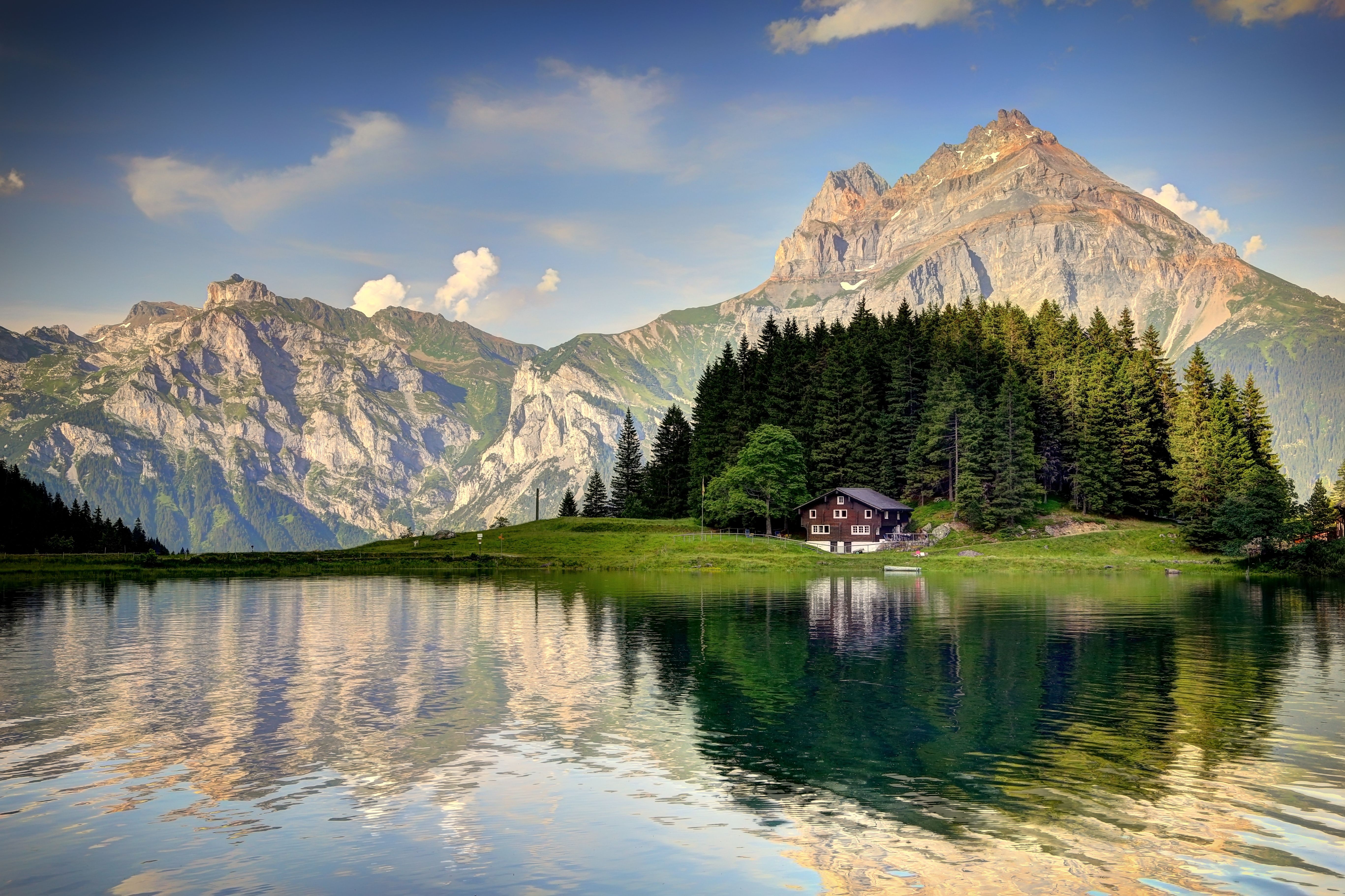 Download 5467x3642 switzerland alps, house, mountains, river, forest, beauty, nature, lake Wallpaper