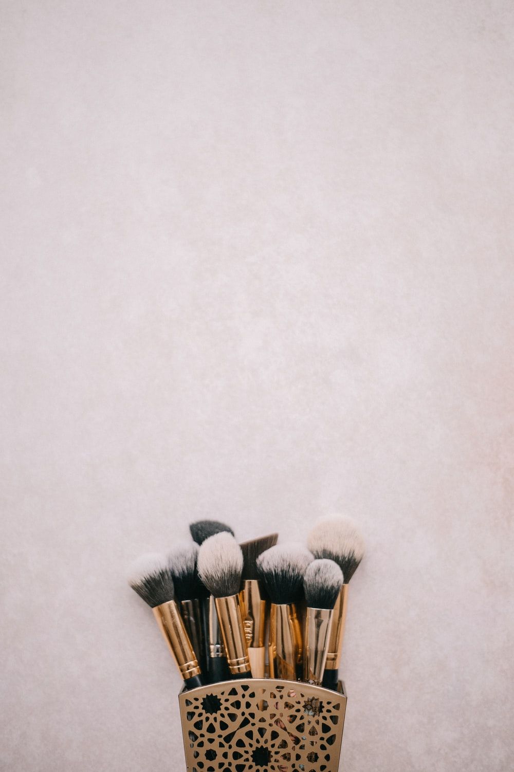 Brass Colored And Black Makeup Brush Kit Photo
