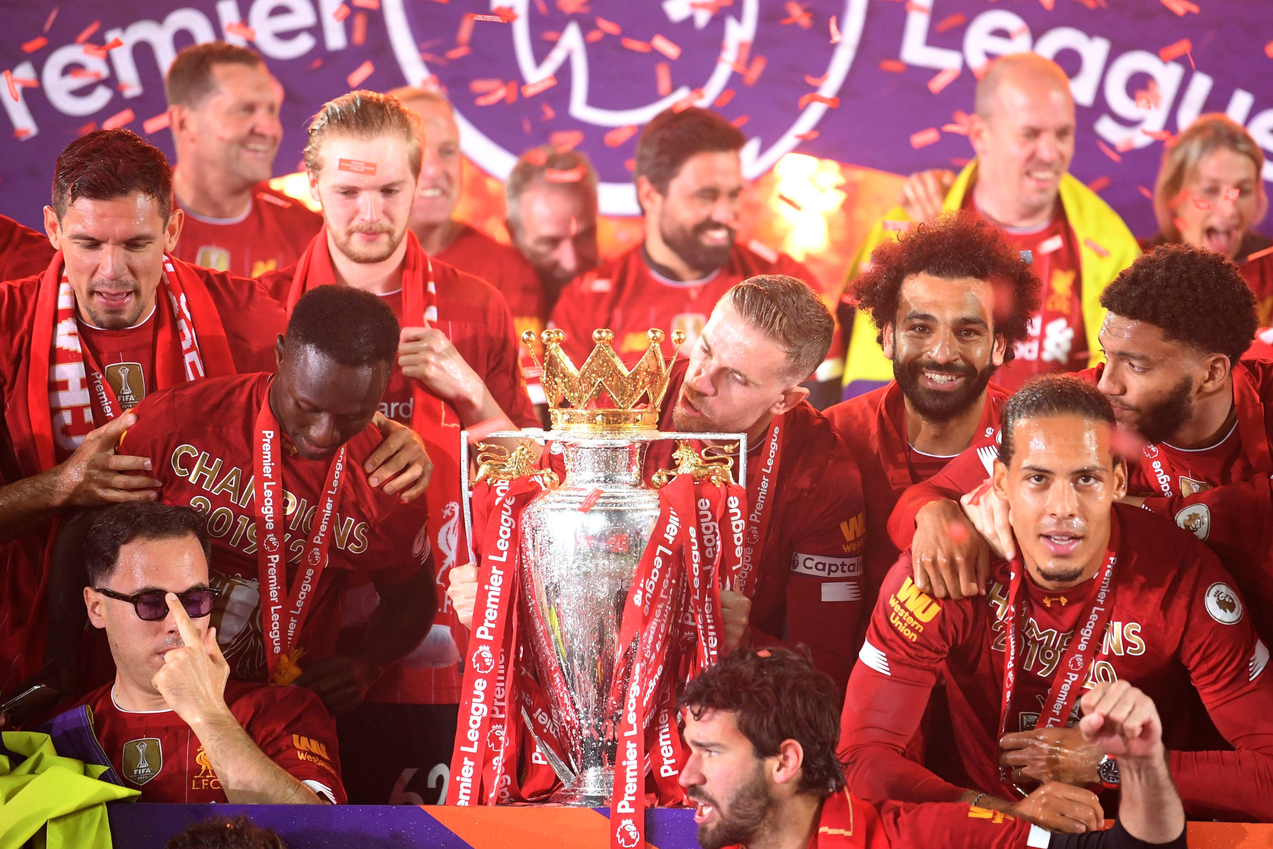 In Picture: Liverpool players celebrate with Premier League trophy