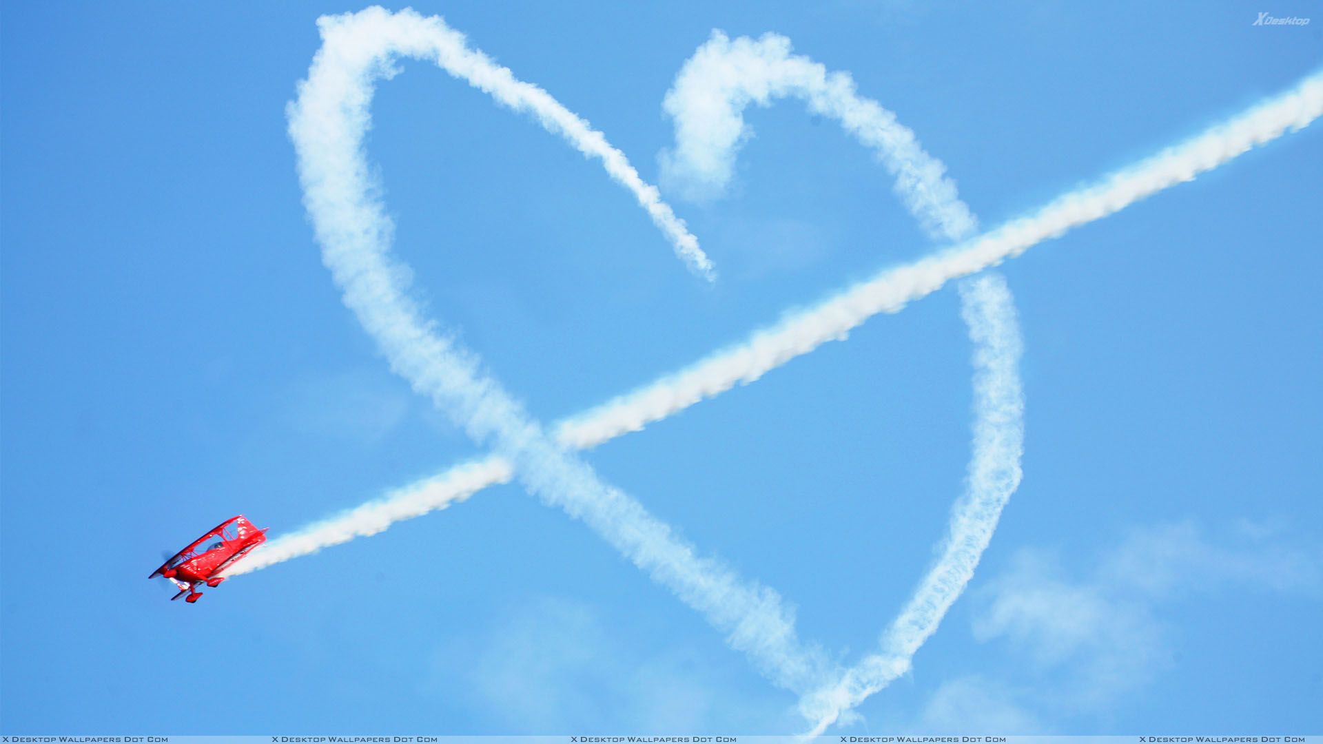 Plane Making Love Sign And Blue Background Wallpaper