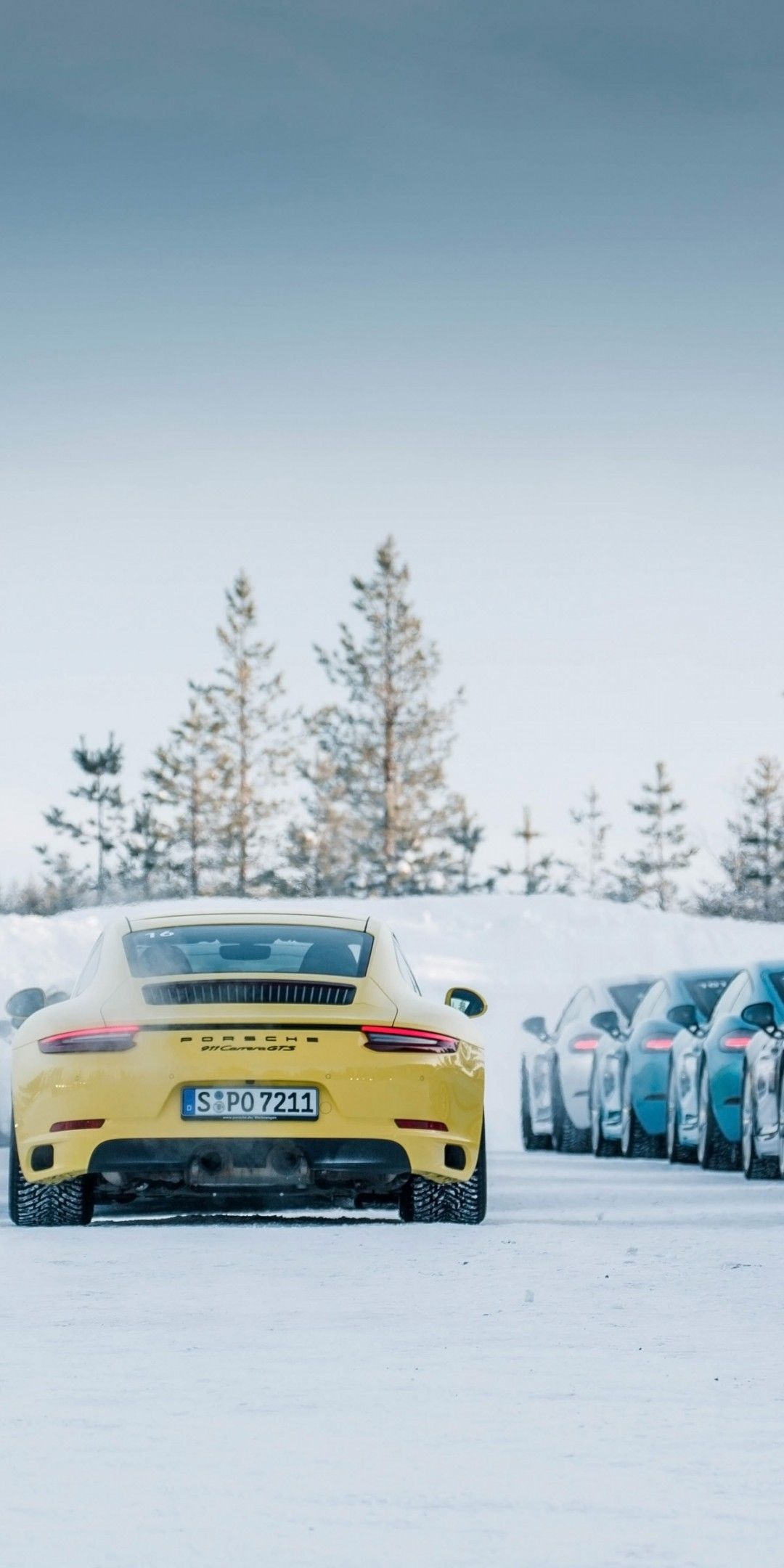 Download 1080x2160 Porsche, Blue And Yellow, Supercars, Ice, Snow Wallpaper for Huawei Mate 10