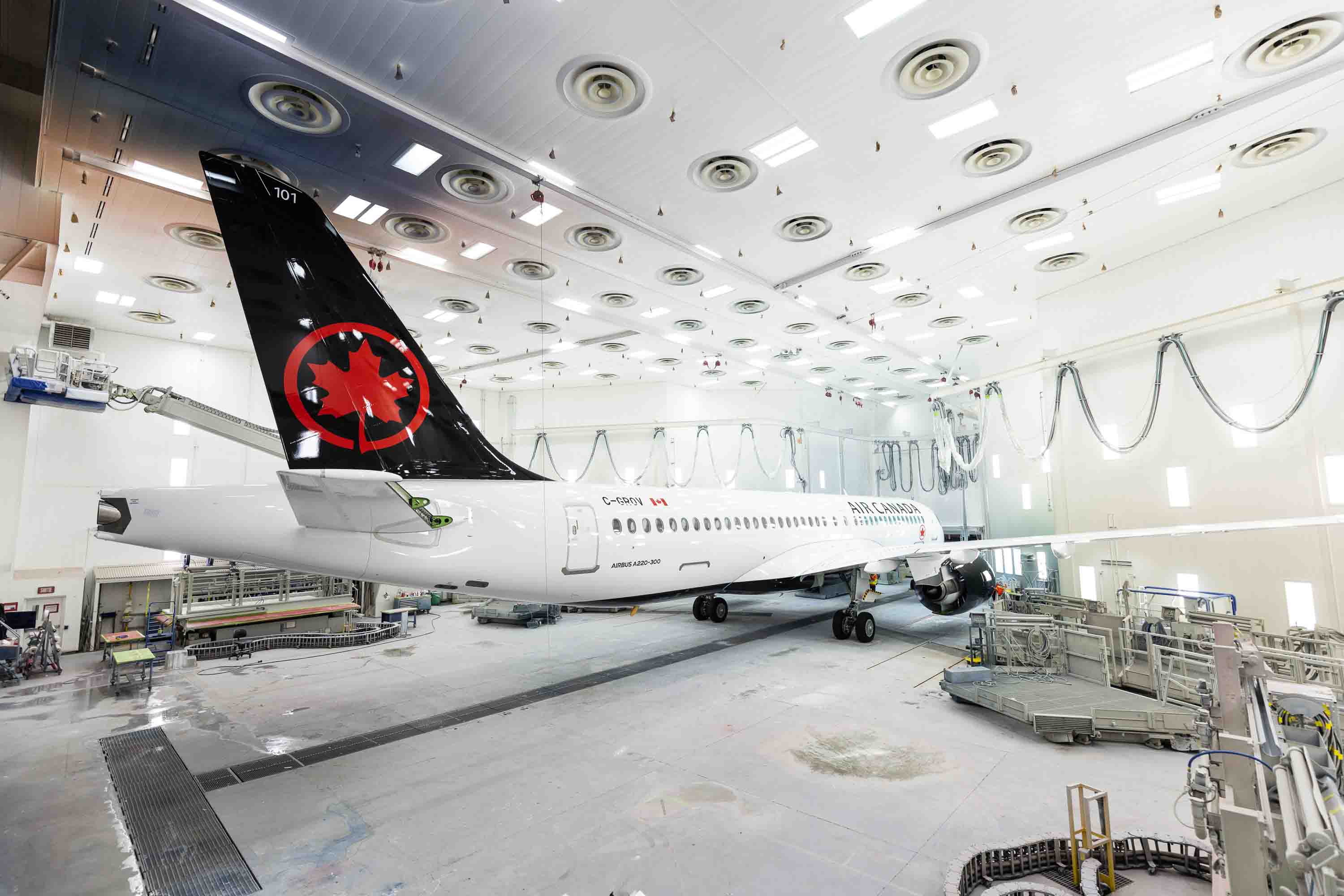 The first A220 for Air Canada rolls out of the painting hangar