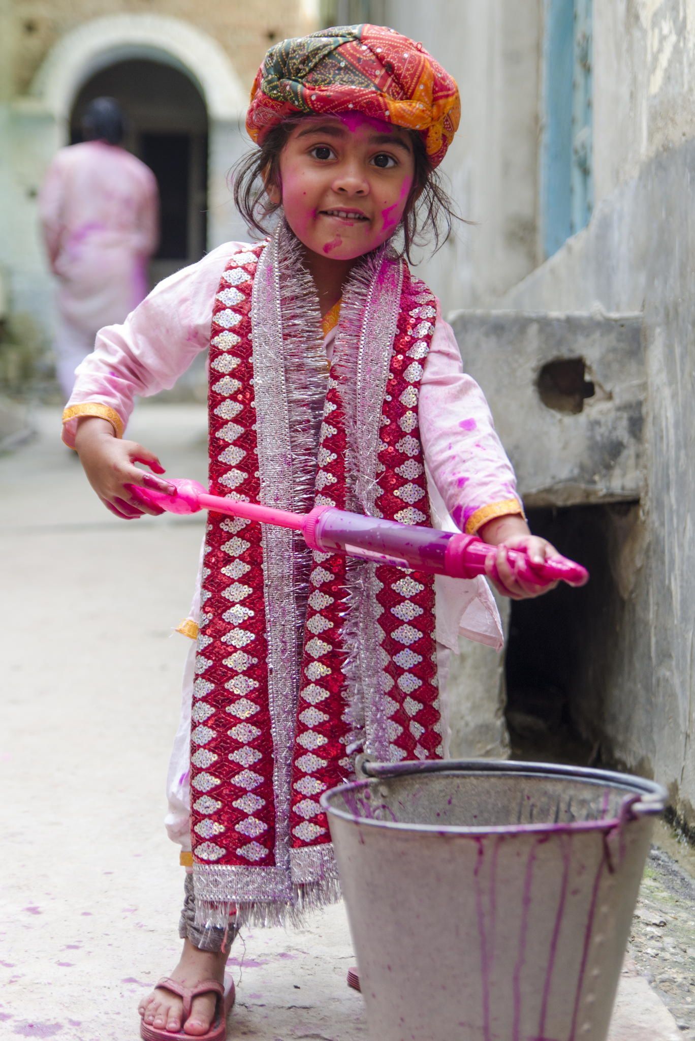 Cute Kid cute kid trying to trying to refill color water. Check out the entire album here. Holi photo, Happy holi image, Holi festival of colours