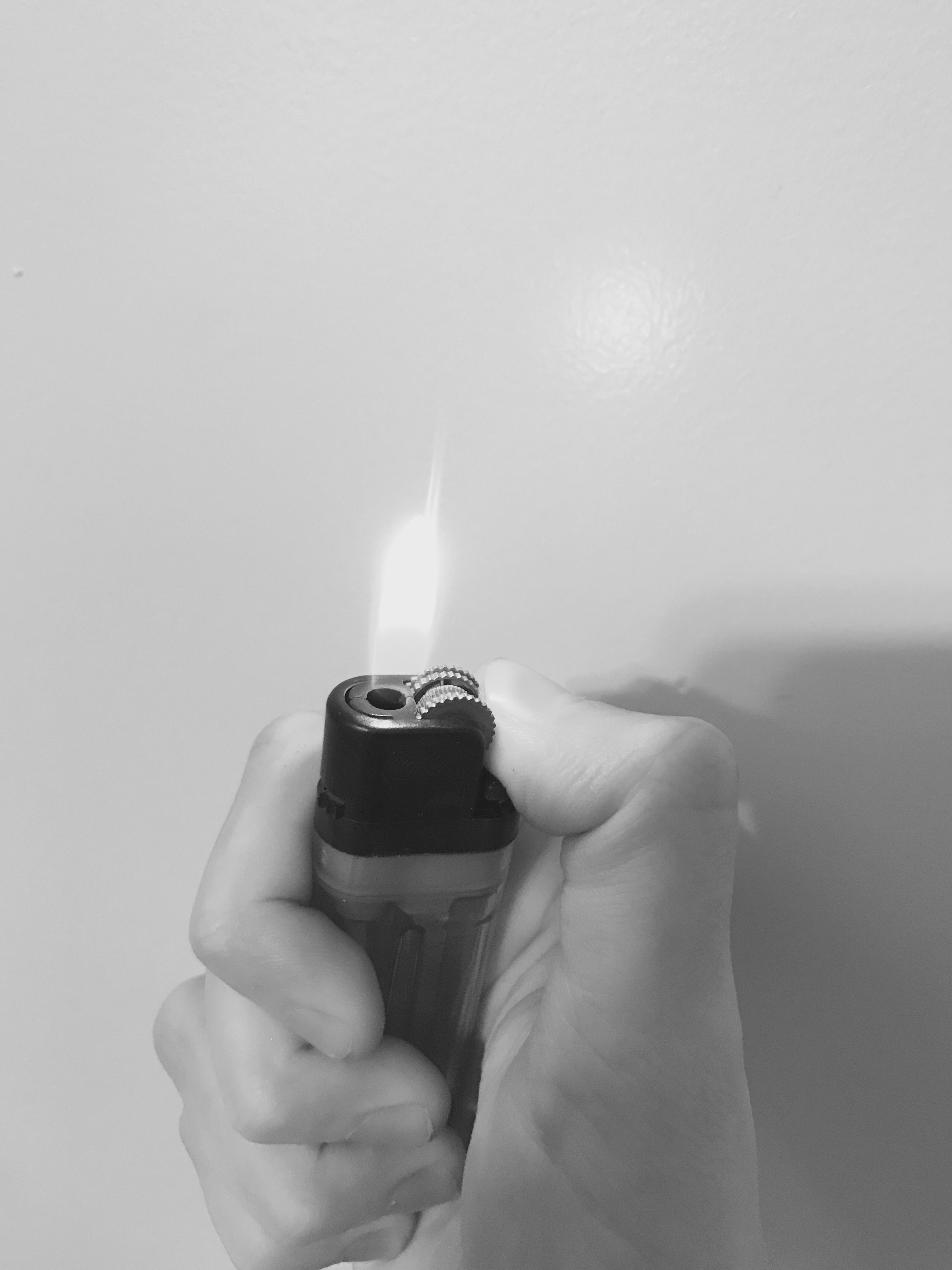 Black and white picture of lighter in hand with fire. Black and white aesthetic, Dark art photography, White aesthetic