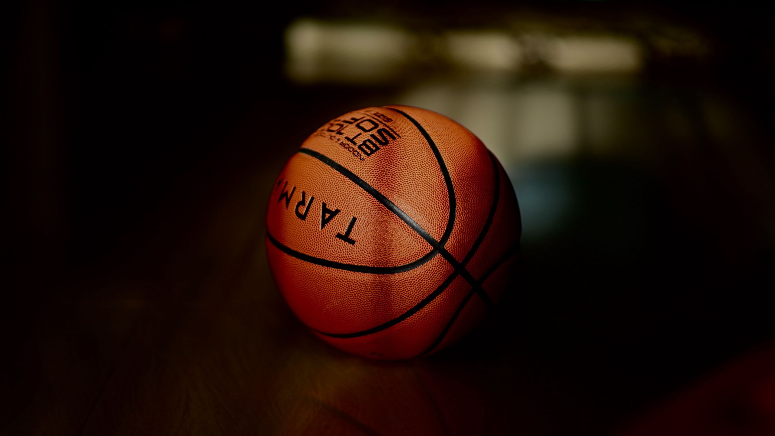 Download wallpaper 2560x1440 basketball, basketball ball, ball, dark widescreen 16:9 HD background
