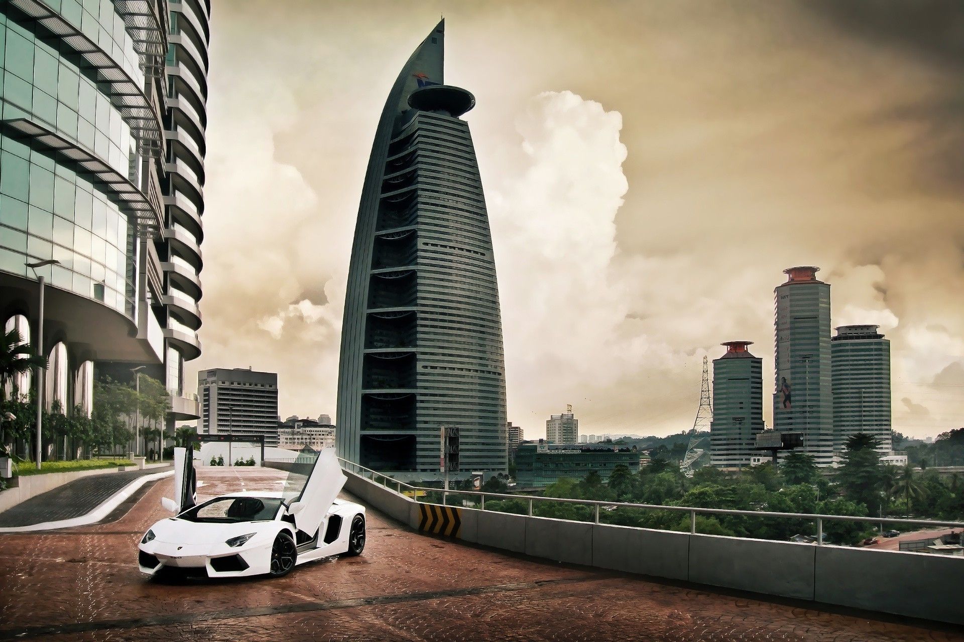 White sports car with open doors at the skyscraper in Dubai