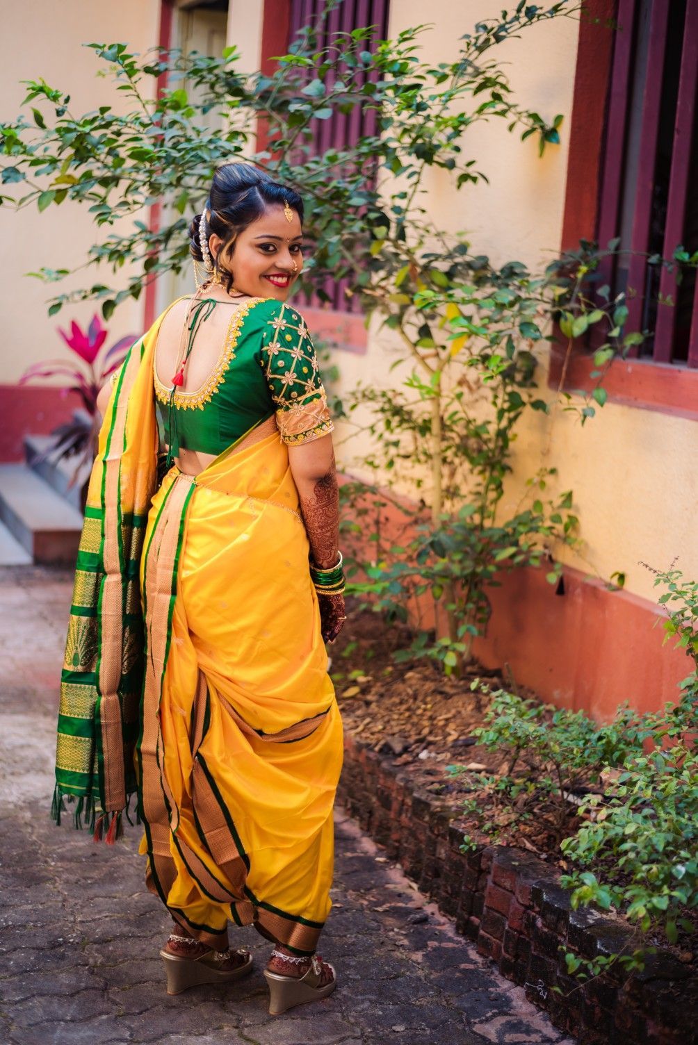 A woman in a yellow sari with a flower in her hair photo – Free Person  Image on Unsplash