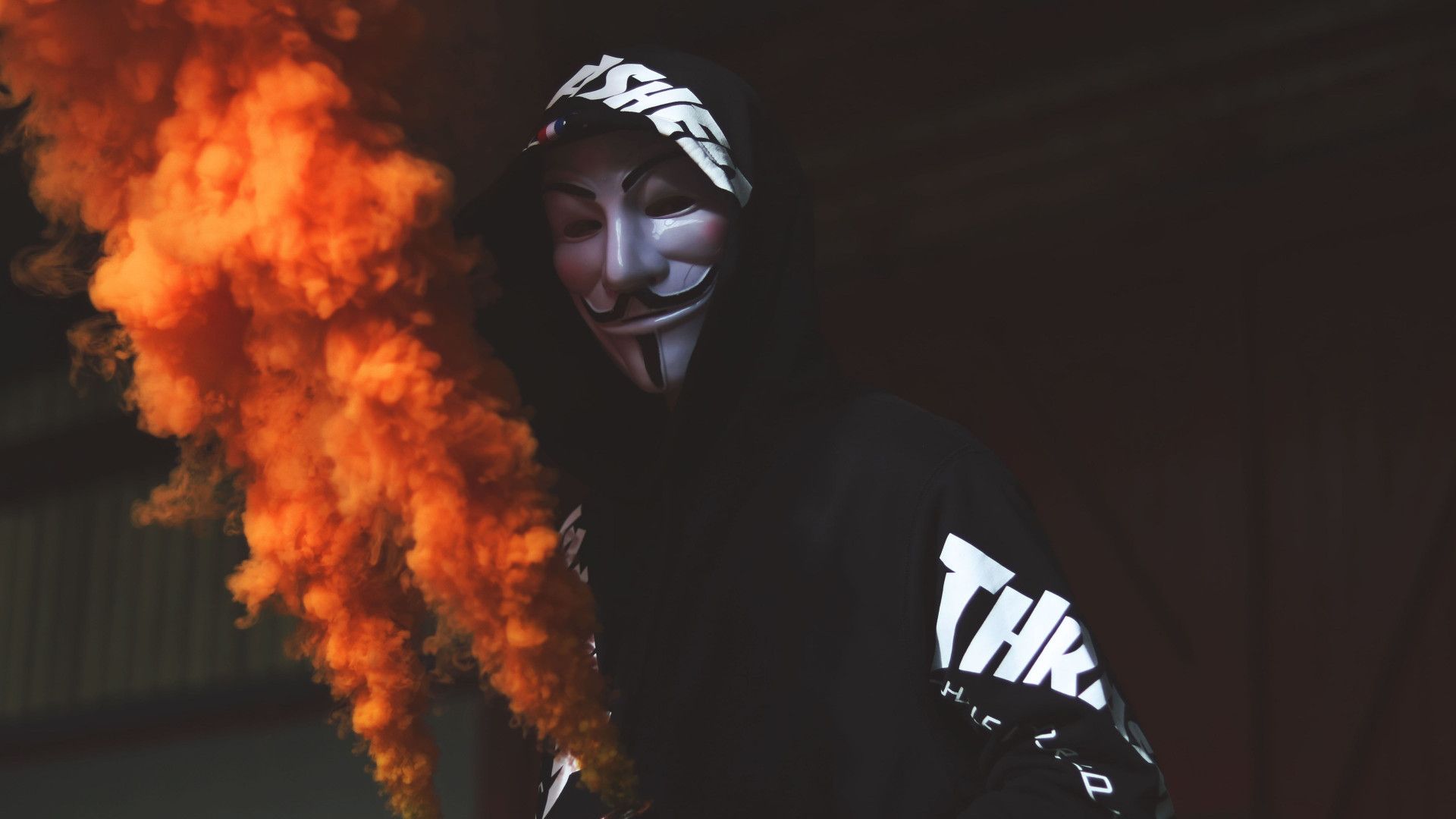 Download wallpaper: Anonymous mask and orange smoke 1920x1080