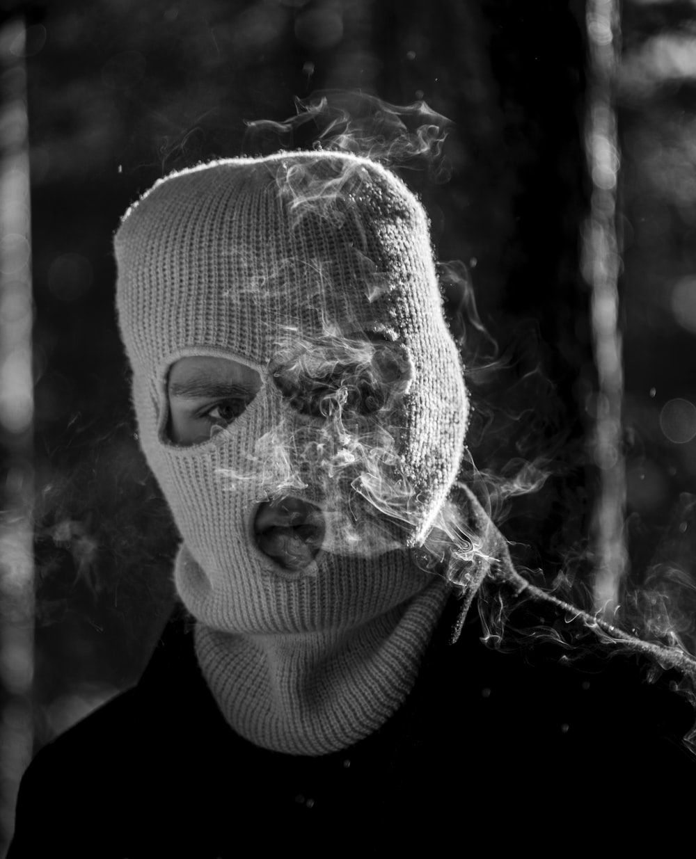 grayscale photo of person wearing mask photo