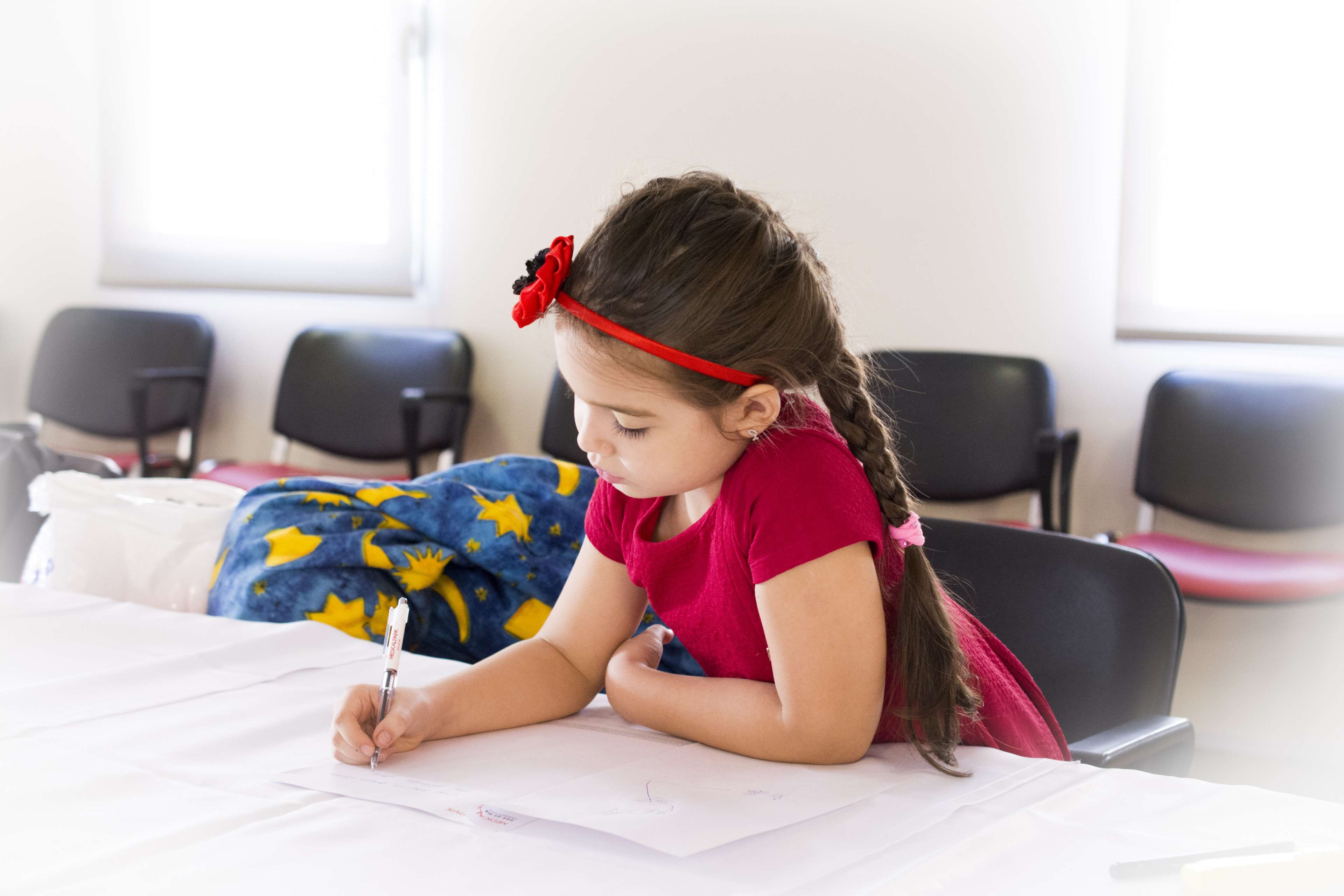 chairs, child, cute, girl, hairdo, kid, learning, student, study, table, writing, young 4k wallpaper