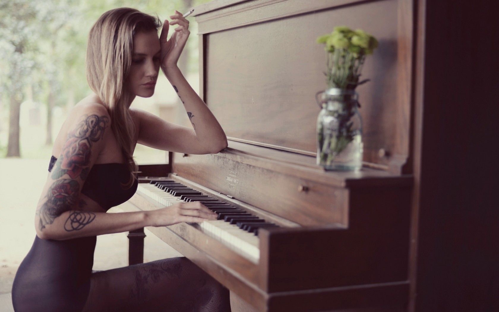 Girl with tattoo playing the piano wallpaper and image, picture, photo