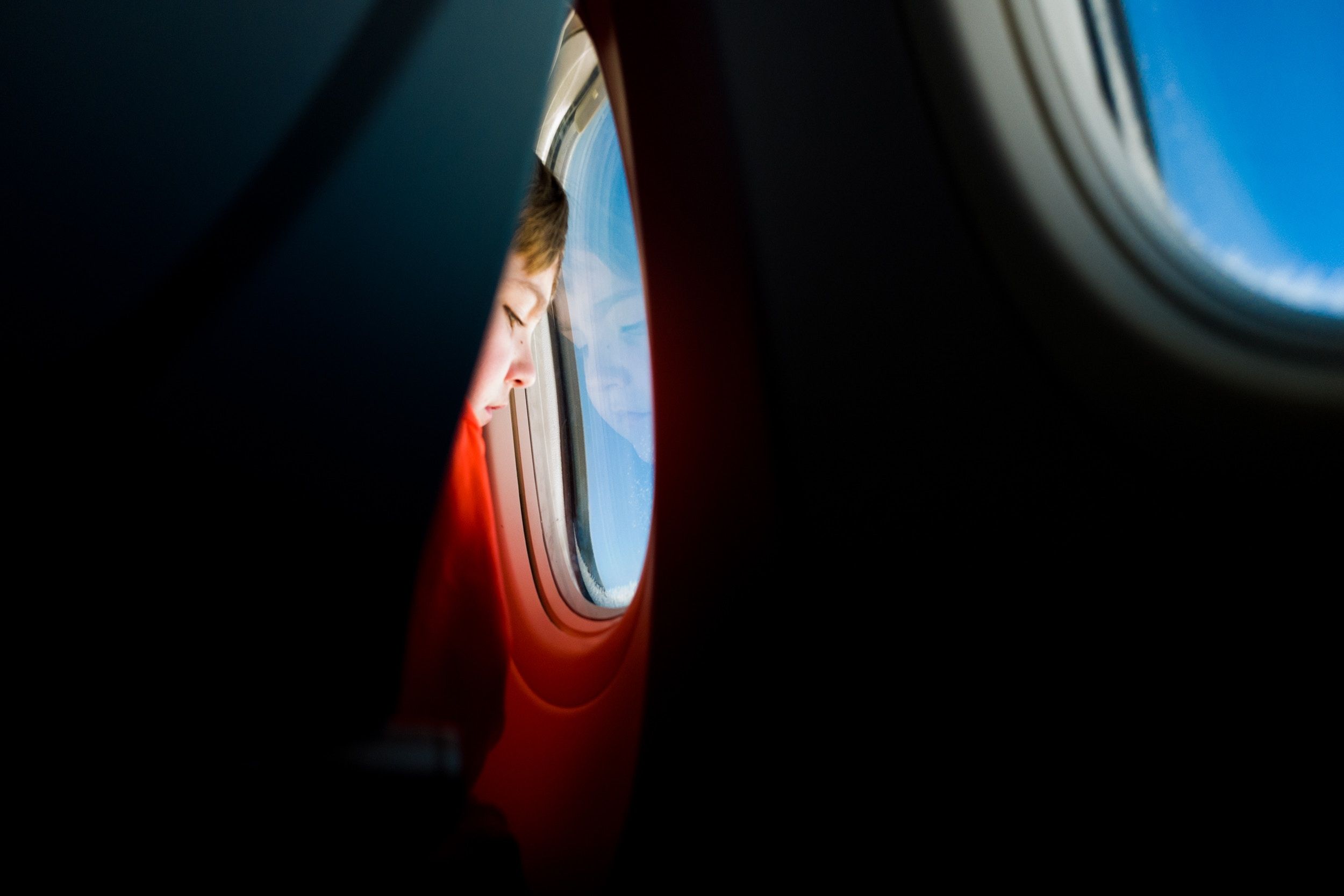 2500x1667 plane, Free picture, wallpaper, window, flying, window plane, inflight, travel wallpaper, sky, travel background, child, travelling, airplane window, airplane, looking, window light, kid, pensive, looking down, boy, fligh