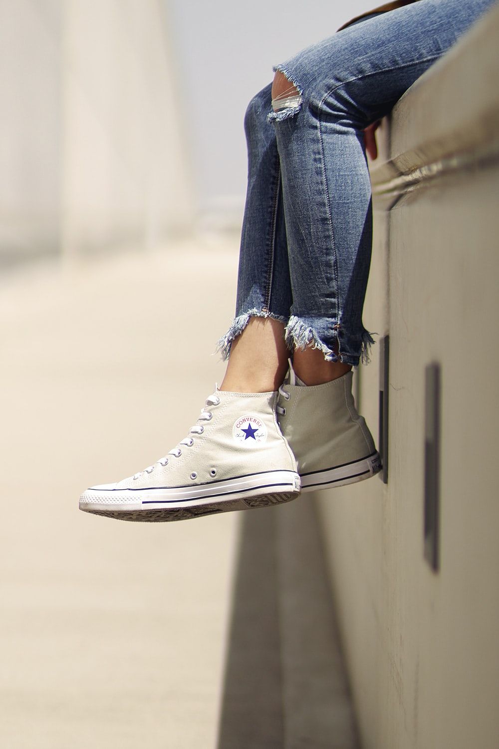 Woman Wearing White Converse Low Top Sneakers Photo