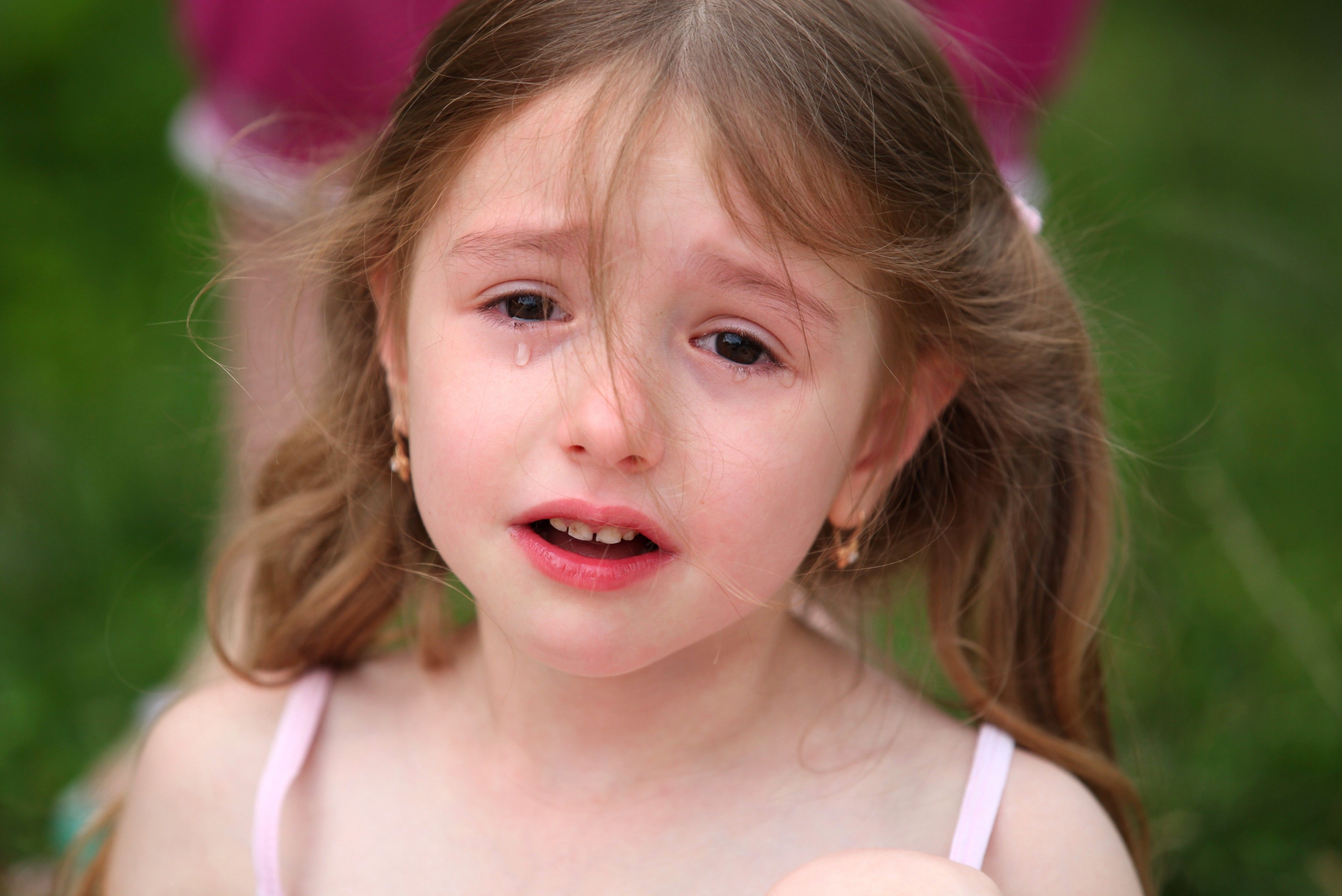 Photo of a cute brunette child girl crying, July 2013