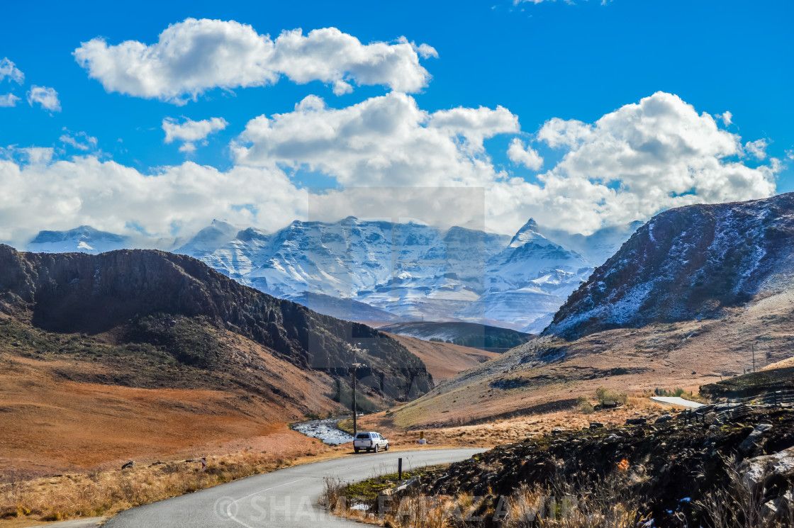 Snow clad capped drakensberg mountains near Sani pass in Underberg, download or print for £6.20
