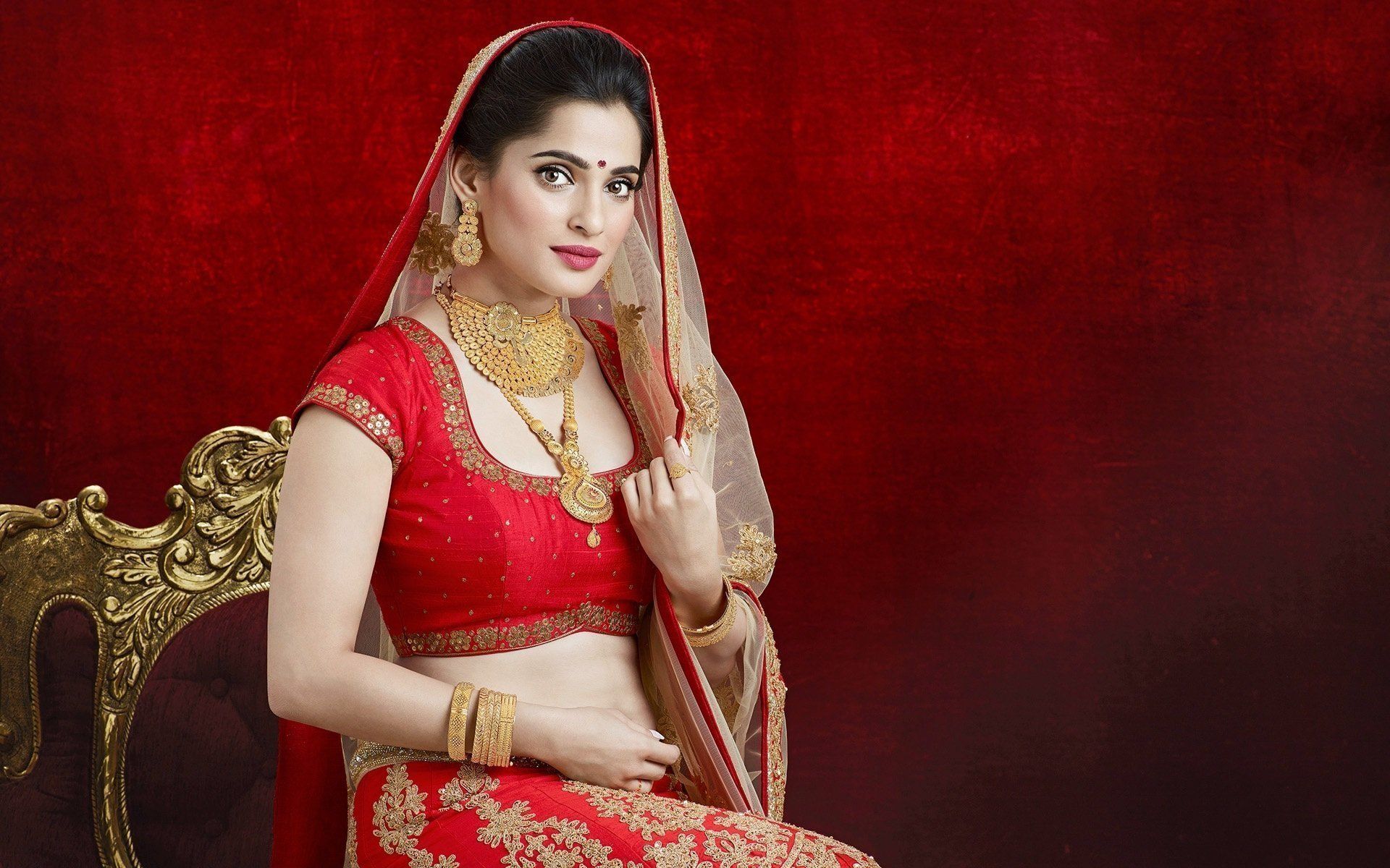 Beautiful Indian Woman In Red Traditional Choli Wallpaper