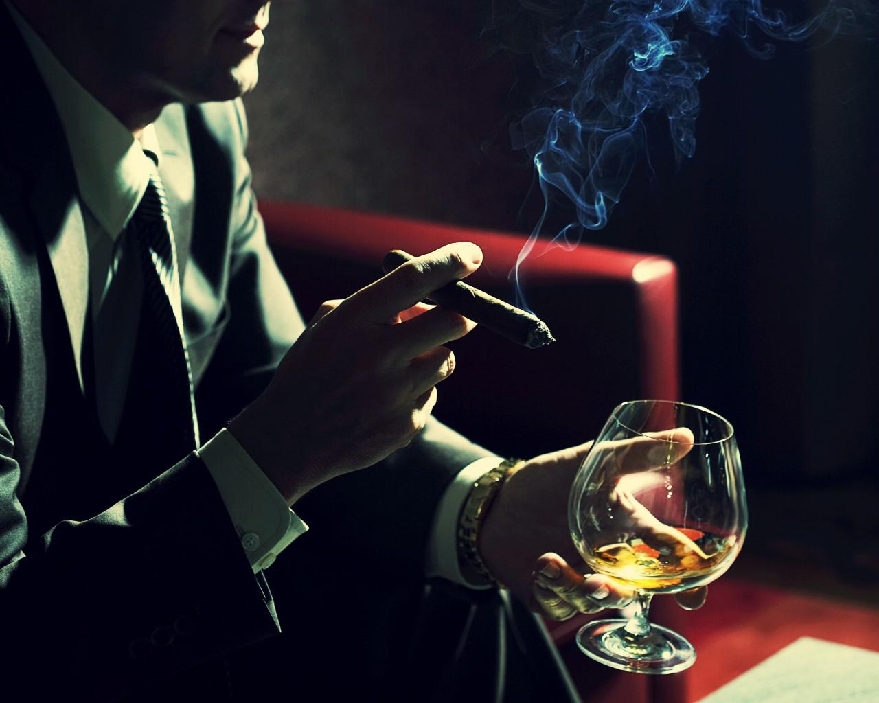Man Smoking Cigar and Drinking Cognac