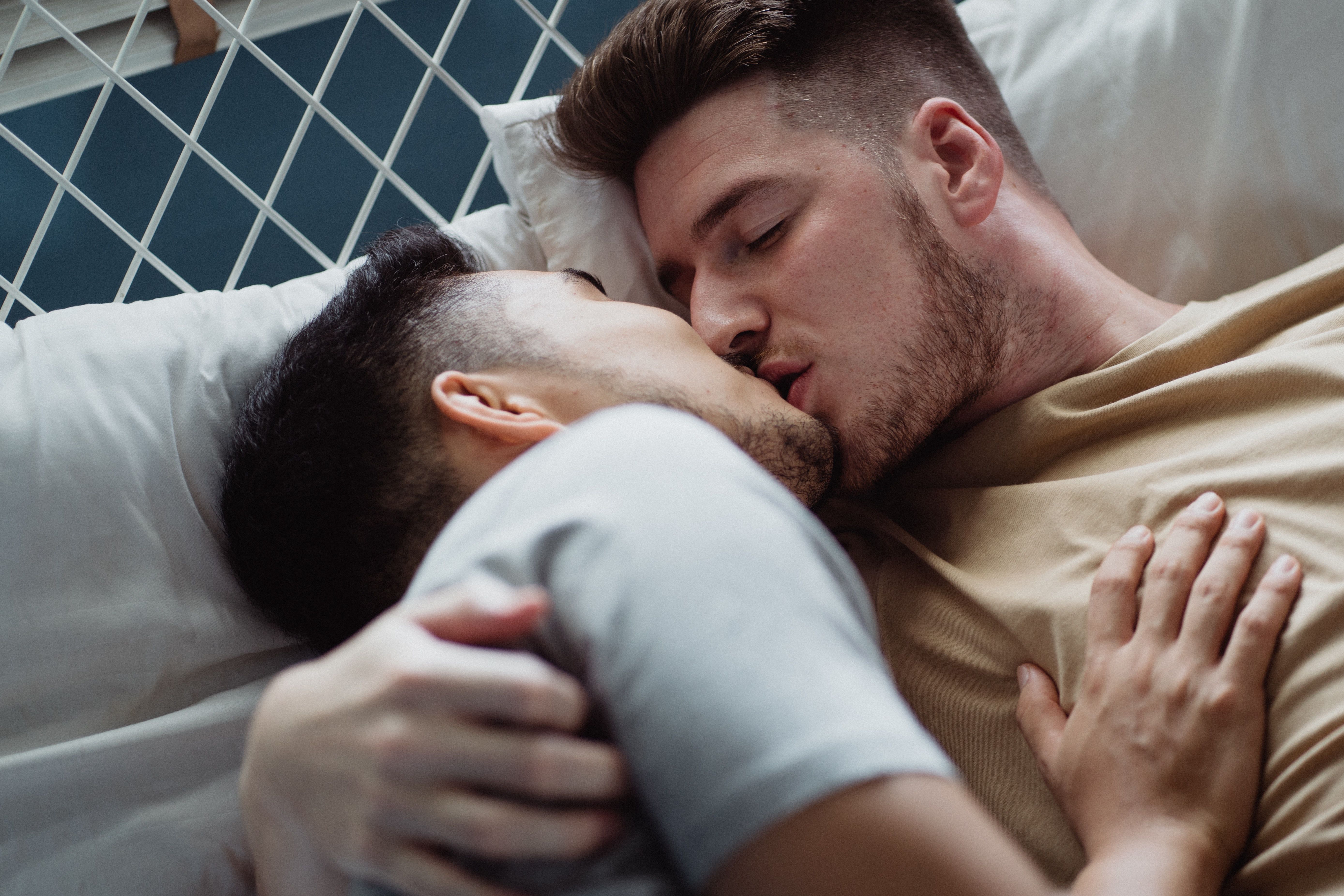 Two Men Kissing in Bed · Free