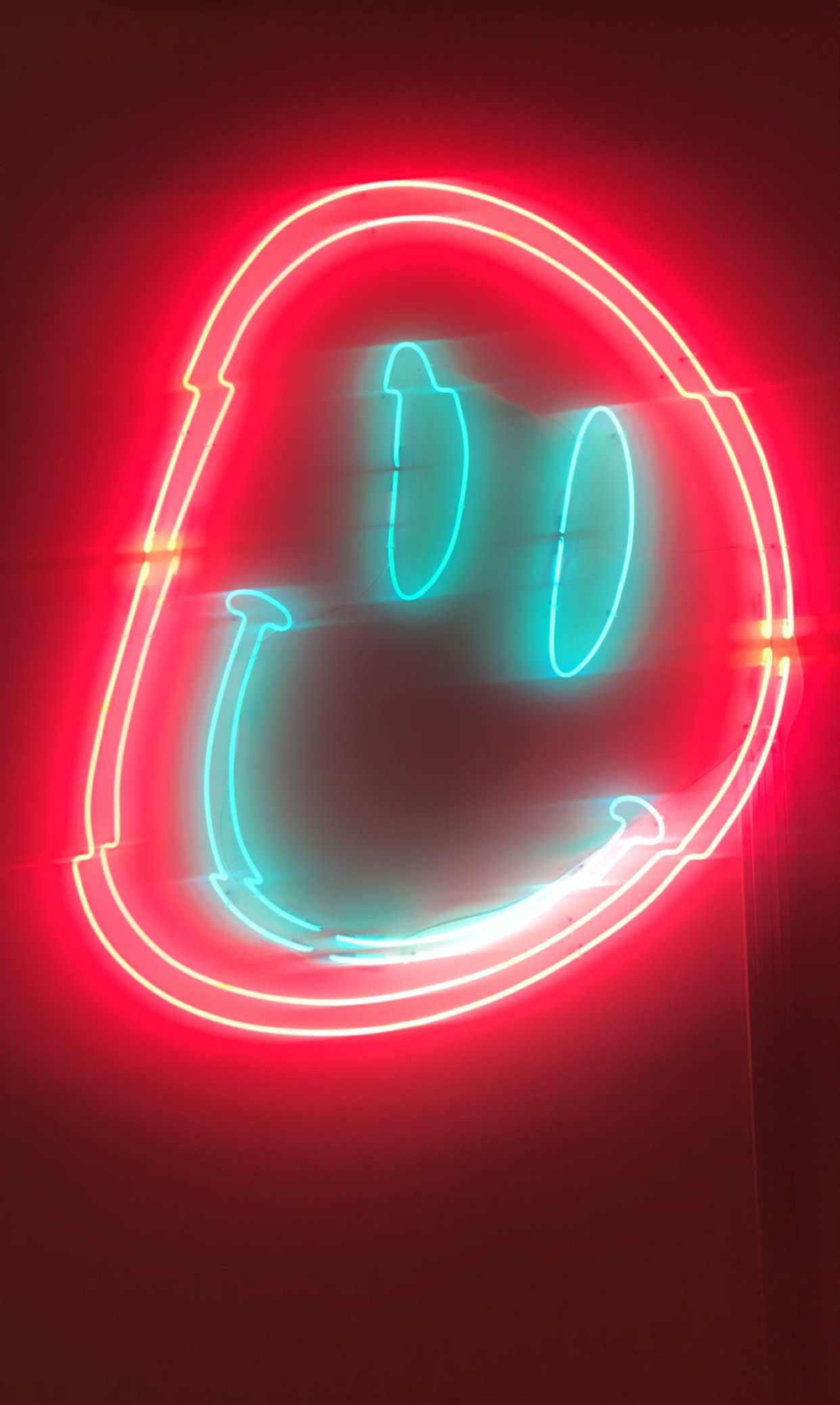 Neon smiley face iPhone wallpaper. Fun