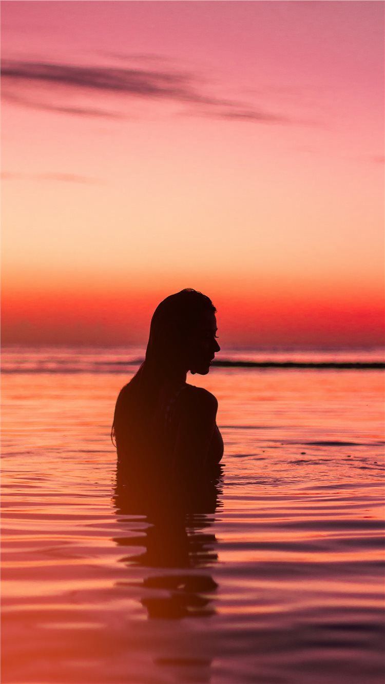 silhouette of woman in body of water iPhone 8 Wallpaper Free Download