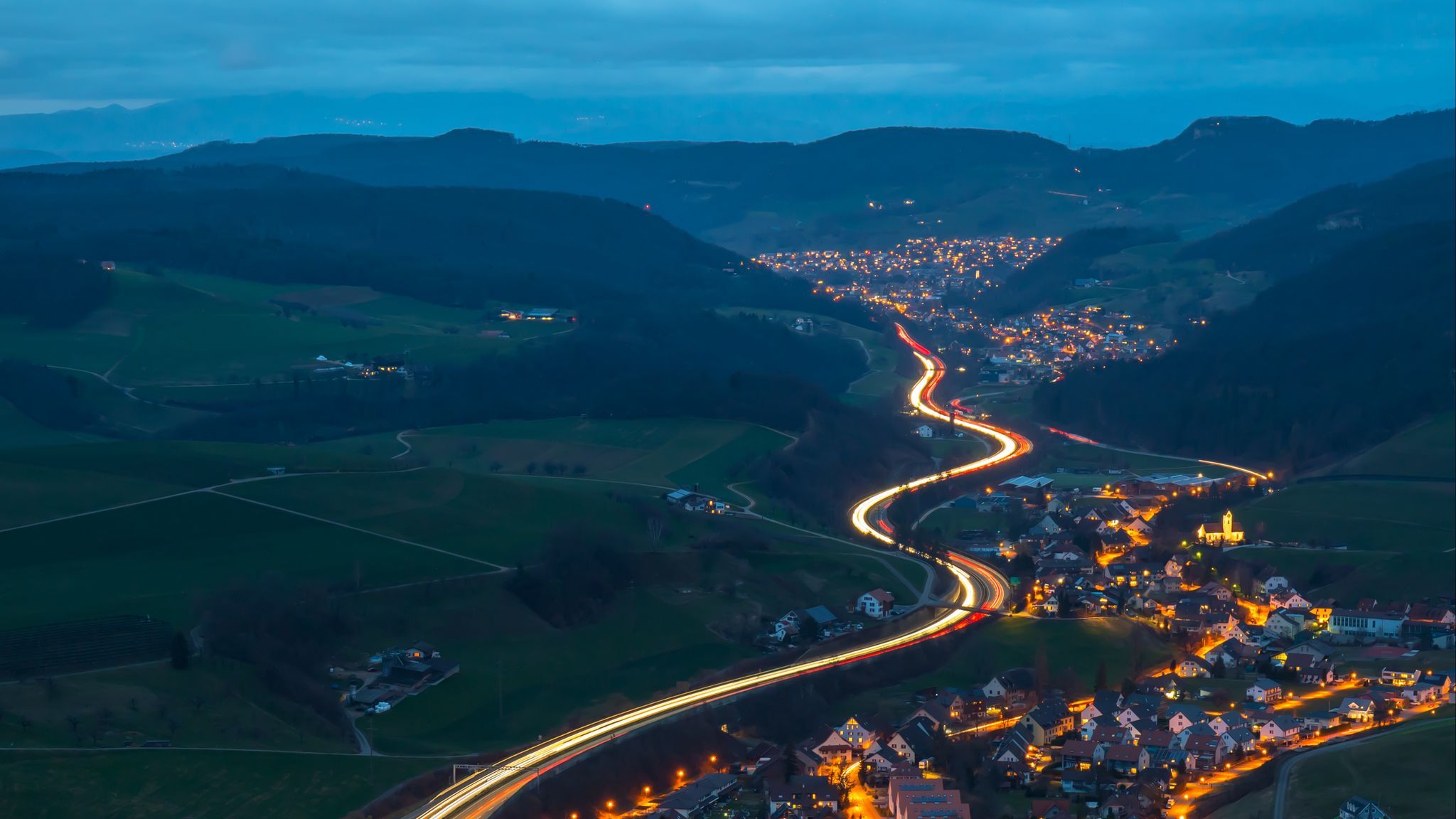 Download wallpaper 2048x1152 village, road, aerial view, night, mountains, switzerland ultrawide monitor HD background