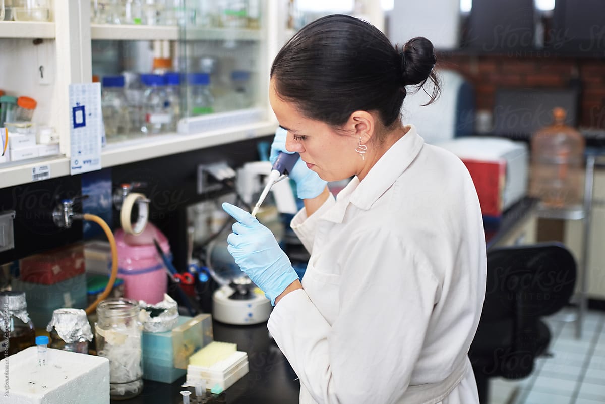 Female scientist working on DNA modification. by PER Image, Scientist