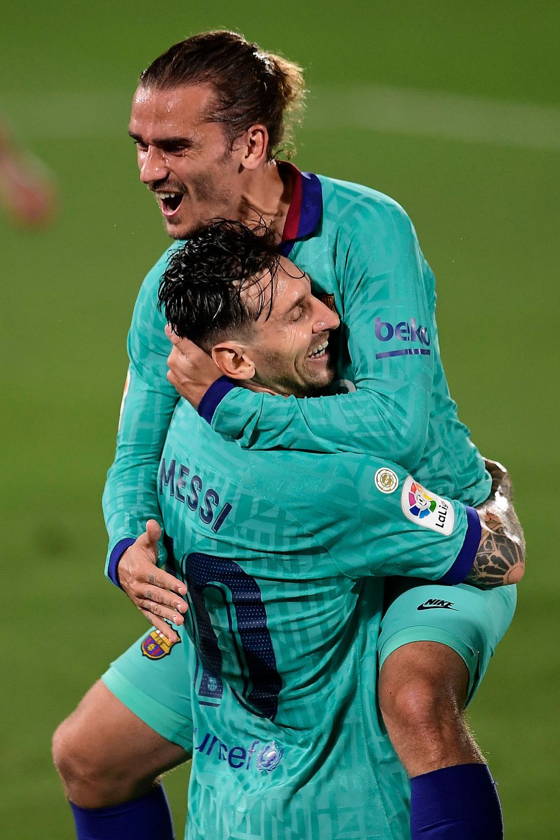 Antoine Griezmann gets celebration hug from Lionel Messi as Barcelona leave troubles behind