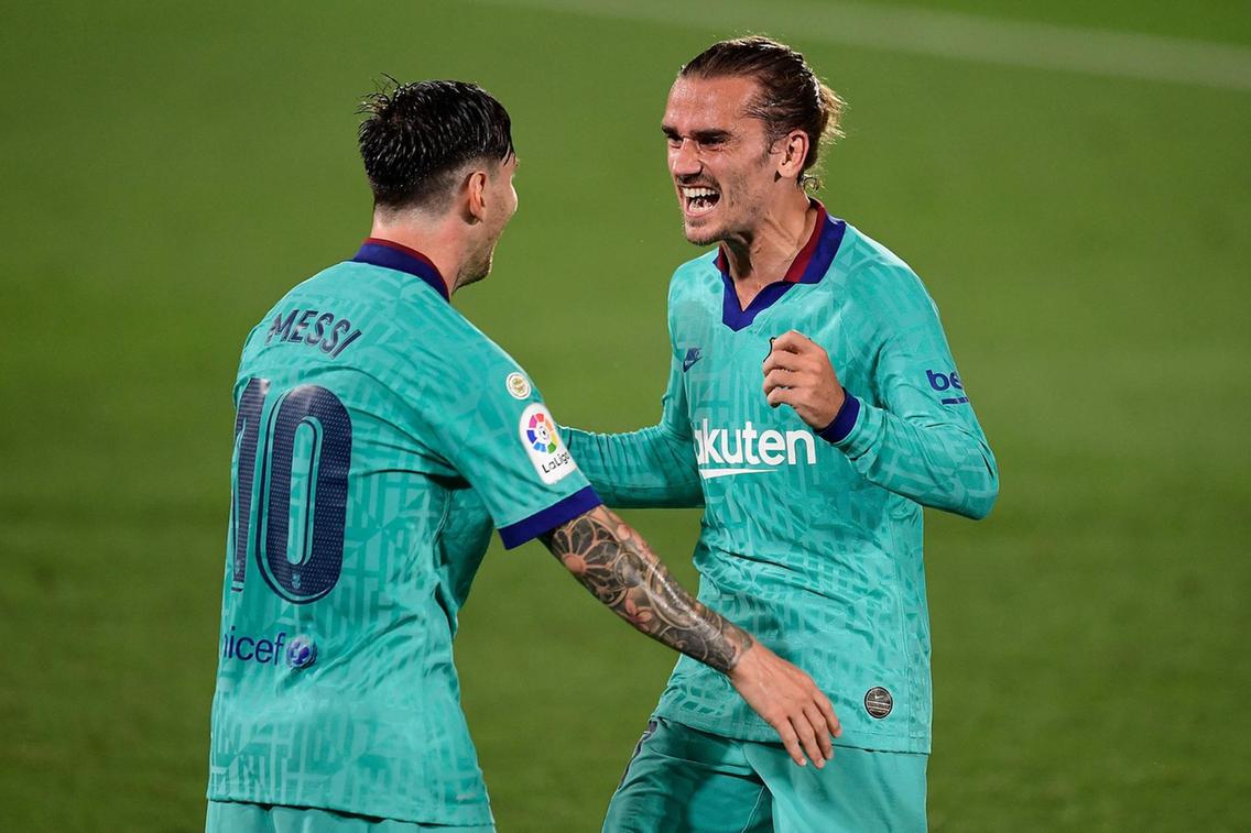 Antoine Griezmann gets celebration hug from Lionel Messi as Barcelona leave troubles behind