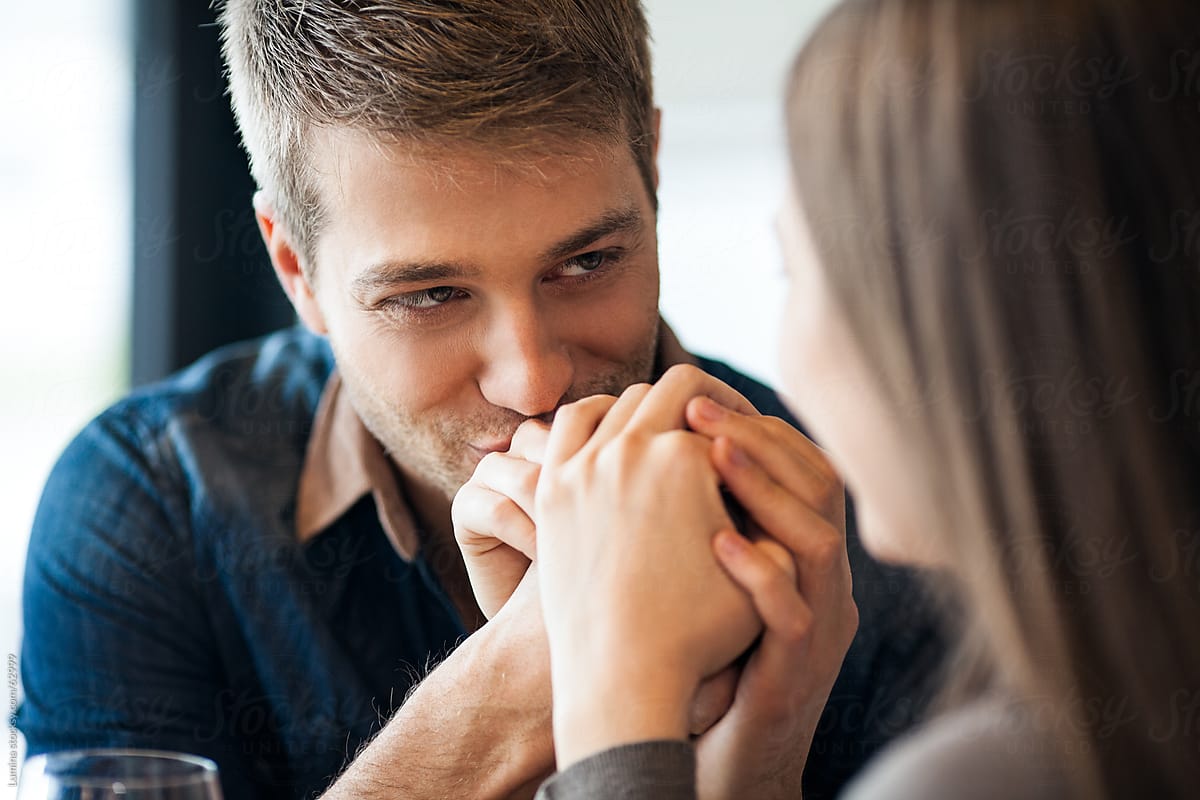 Man Kissing His Girlfriend's Hand