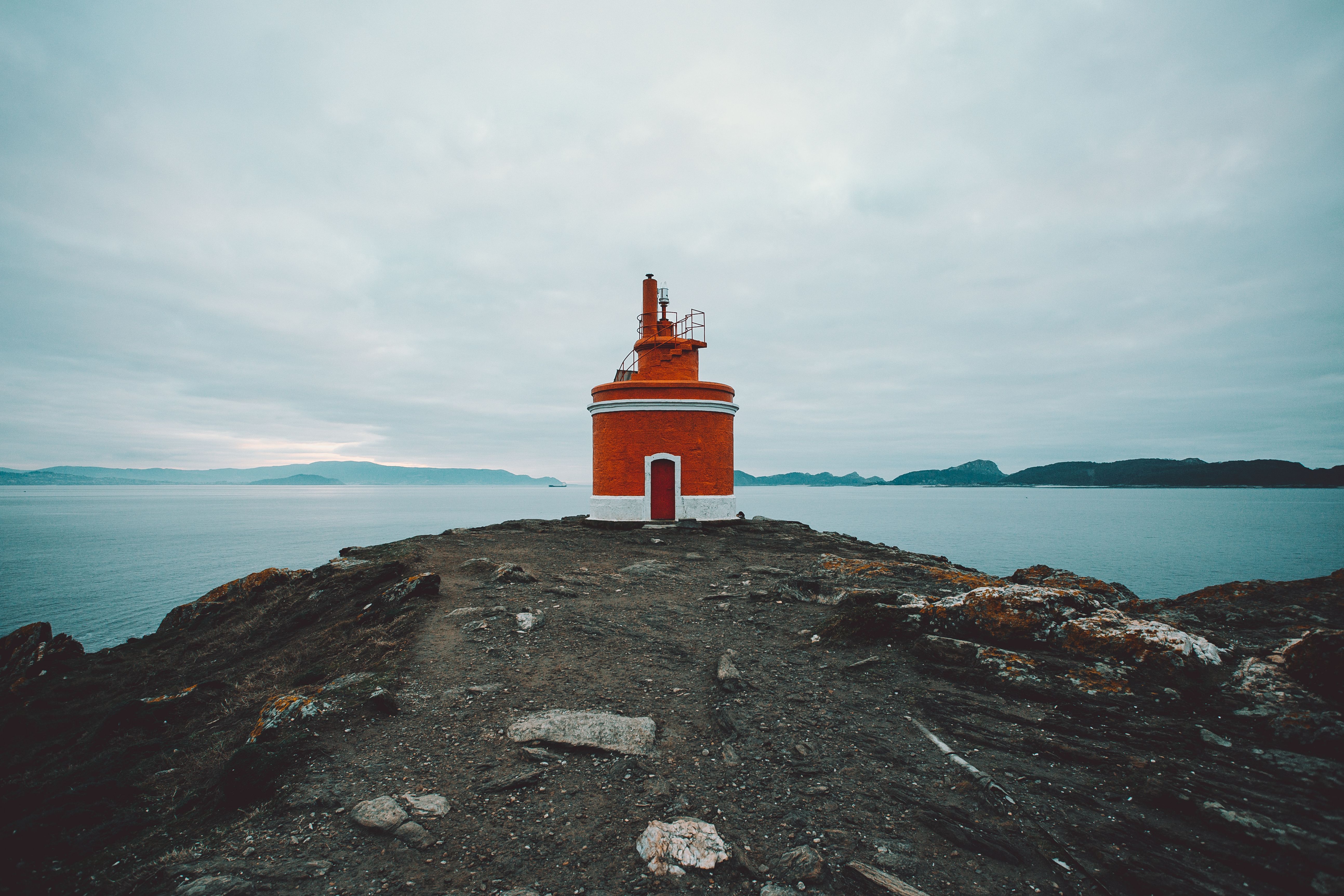 Red and White Lighthouse on Cliff · Free