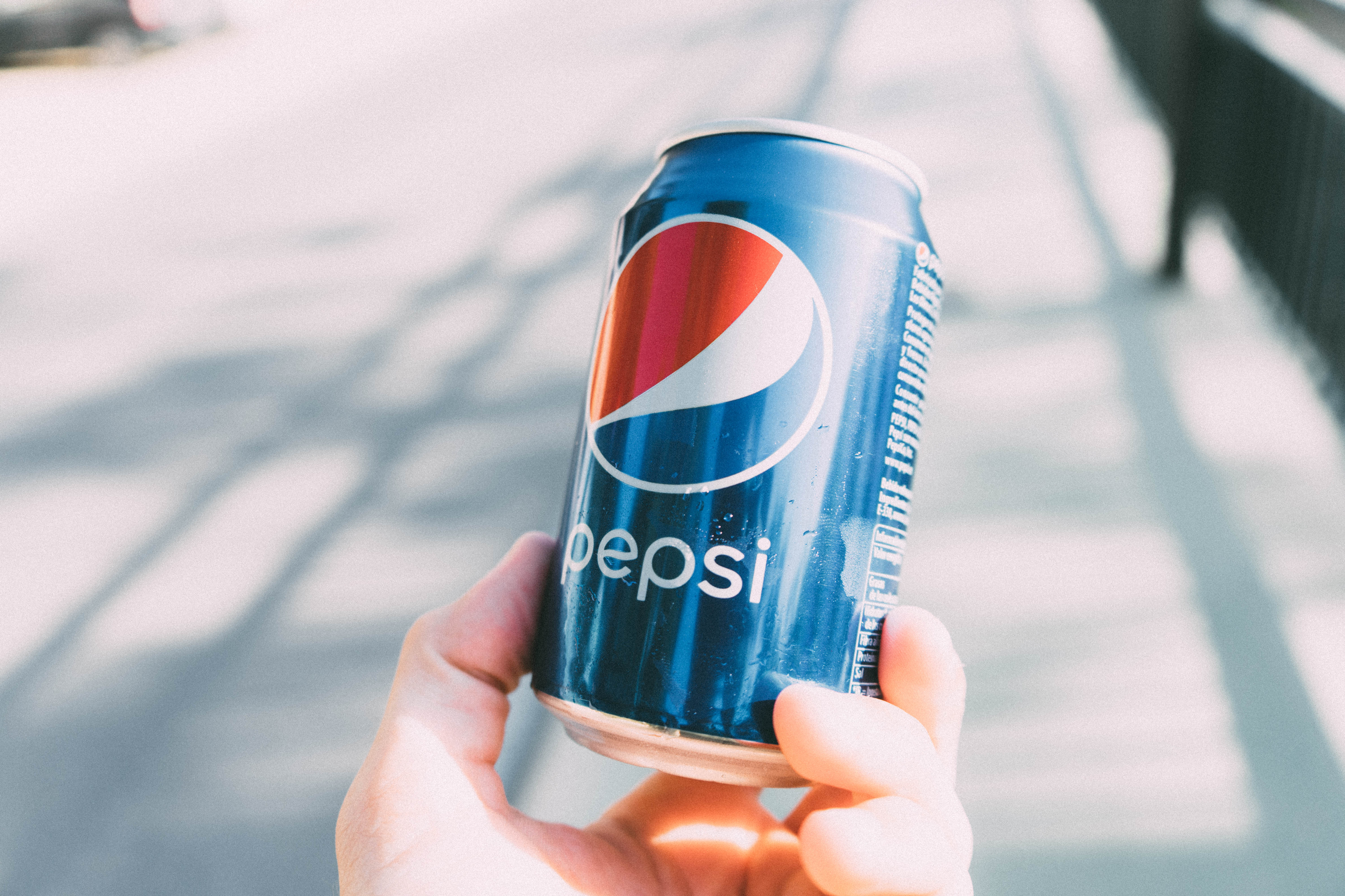Person Holding Pepsi Can · Free