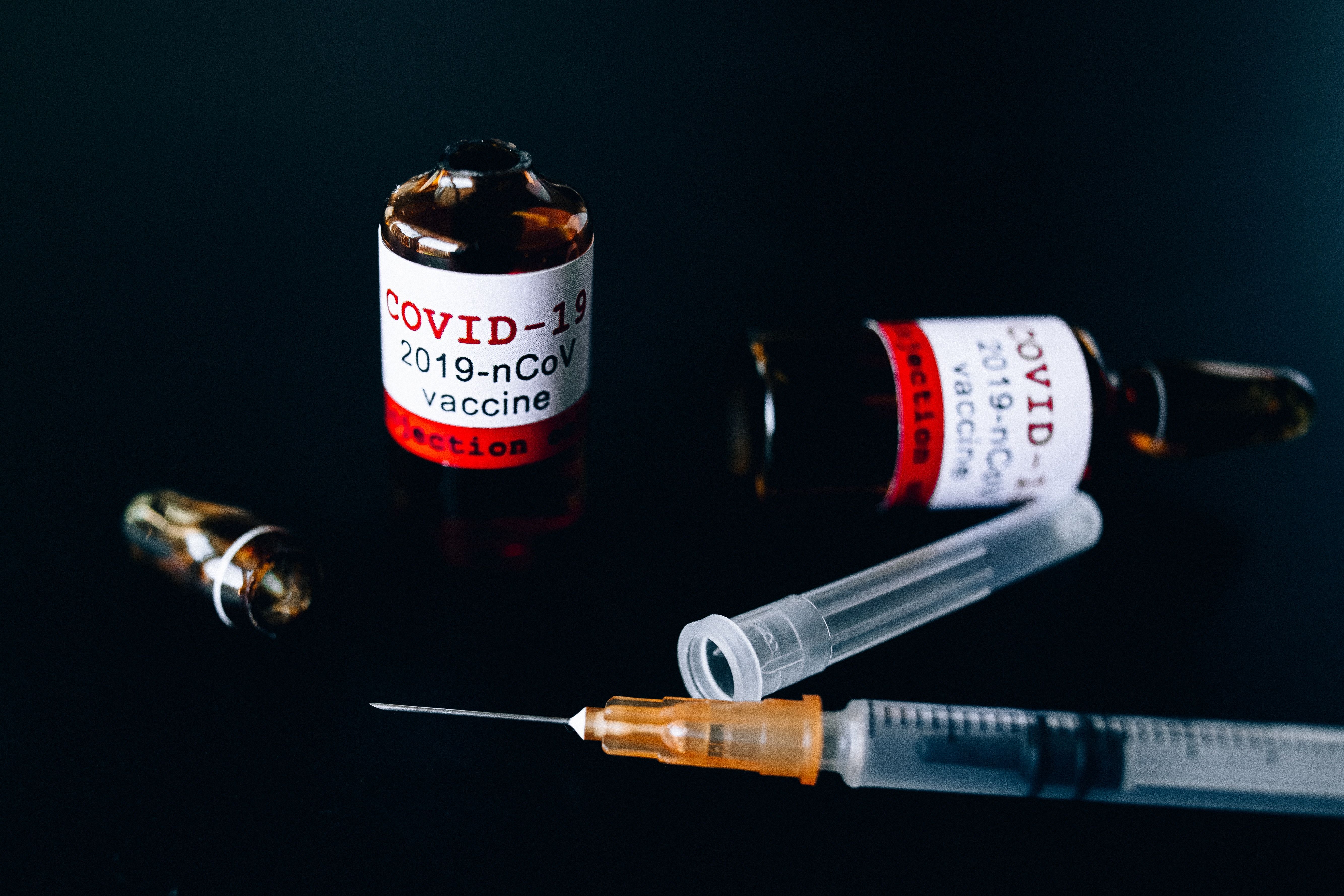Covid Vaccine Bottles and Syringe · Free