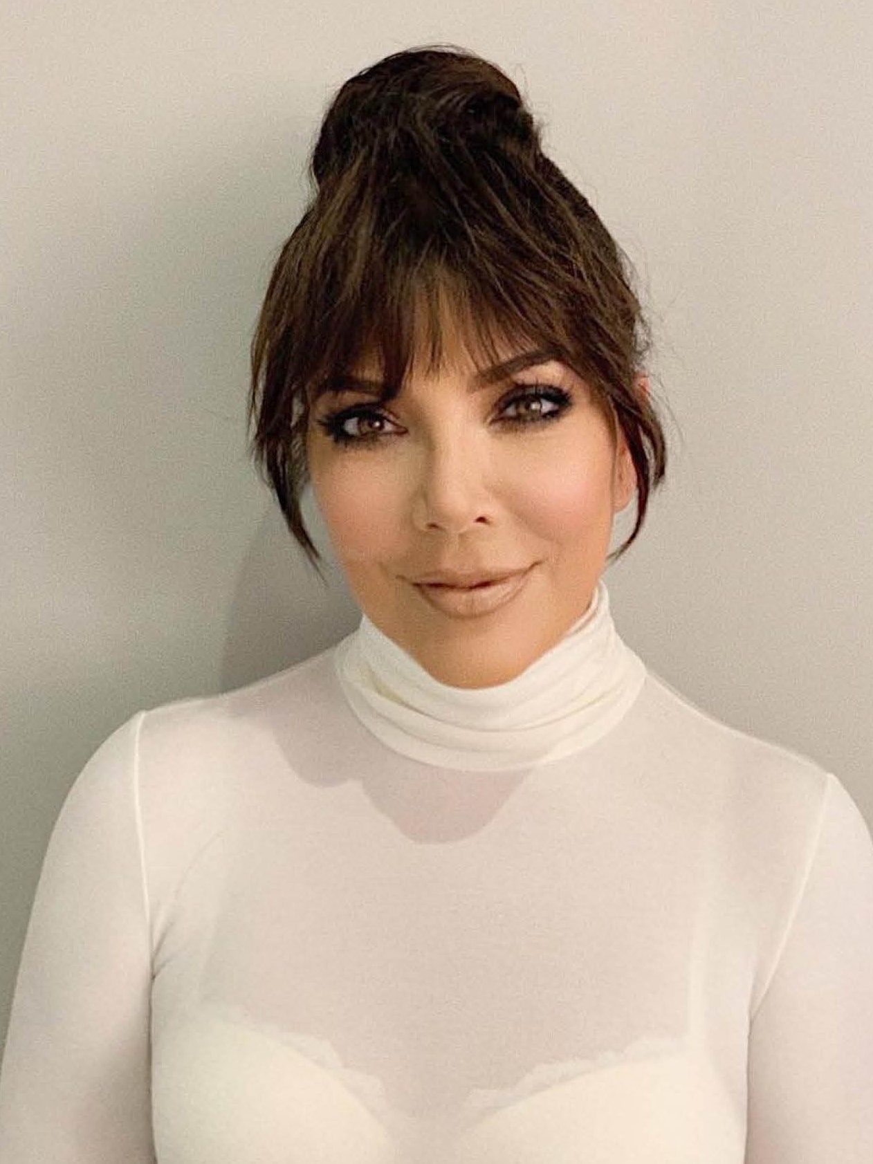 Fans Think Kris Jenner's Topknot Turns Her Into Kim Kardashian's Twin