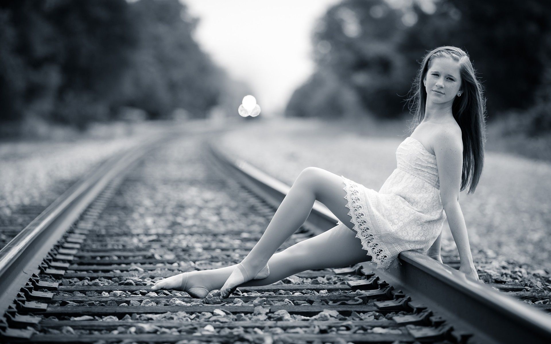 Brunette girls females women woman railway railroad tracks train mood black white wallpaperx1200