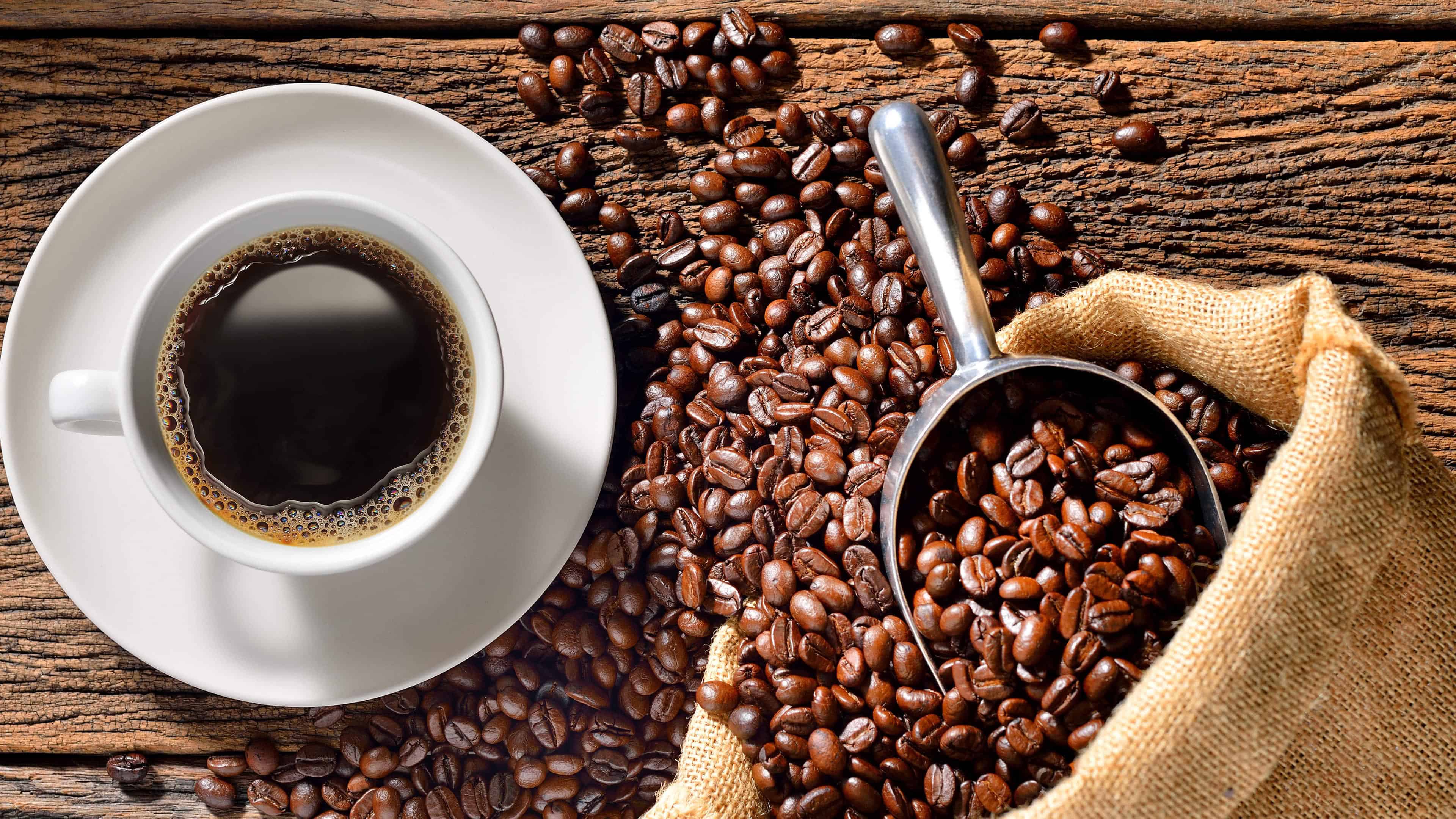 A photo consisting of caffeine sources: coffee beans and a cup of espresso