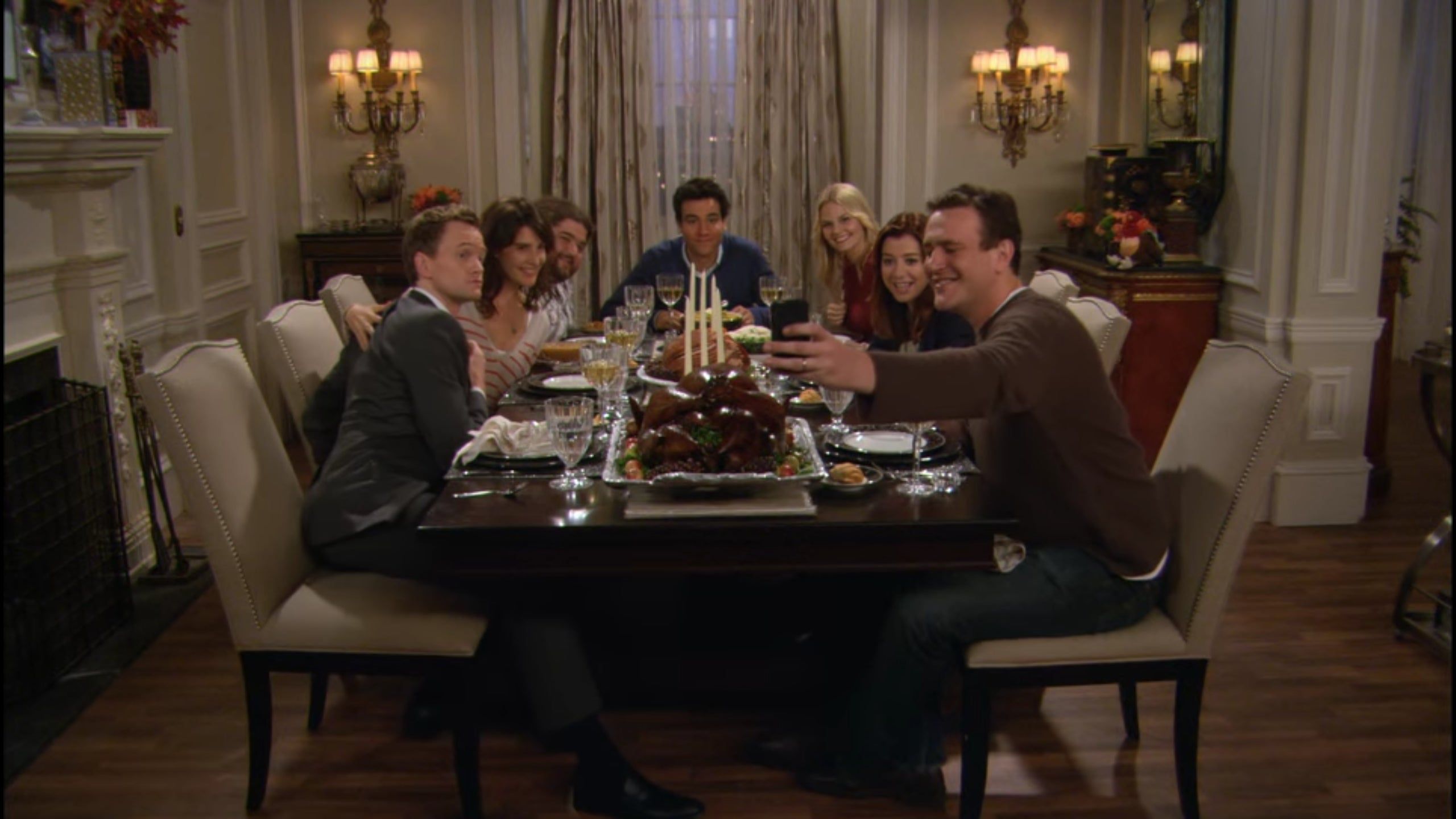 In How I Met Your Mother, Marshall has his eyes closed in every picture. When he takes a picture at a Thanksgiving dinner, he closes his eyes right as the camera goes