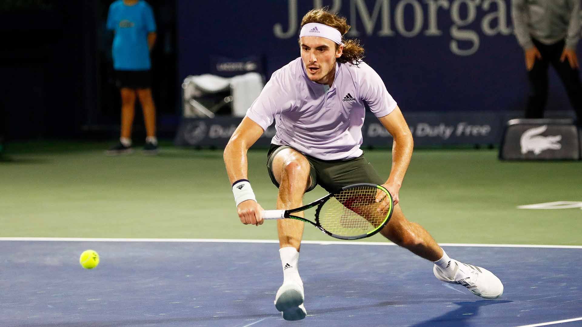 Download Stefanos Tsitsipas In Pink Shirt Wallpaper | Wallpapers.com