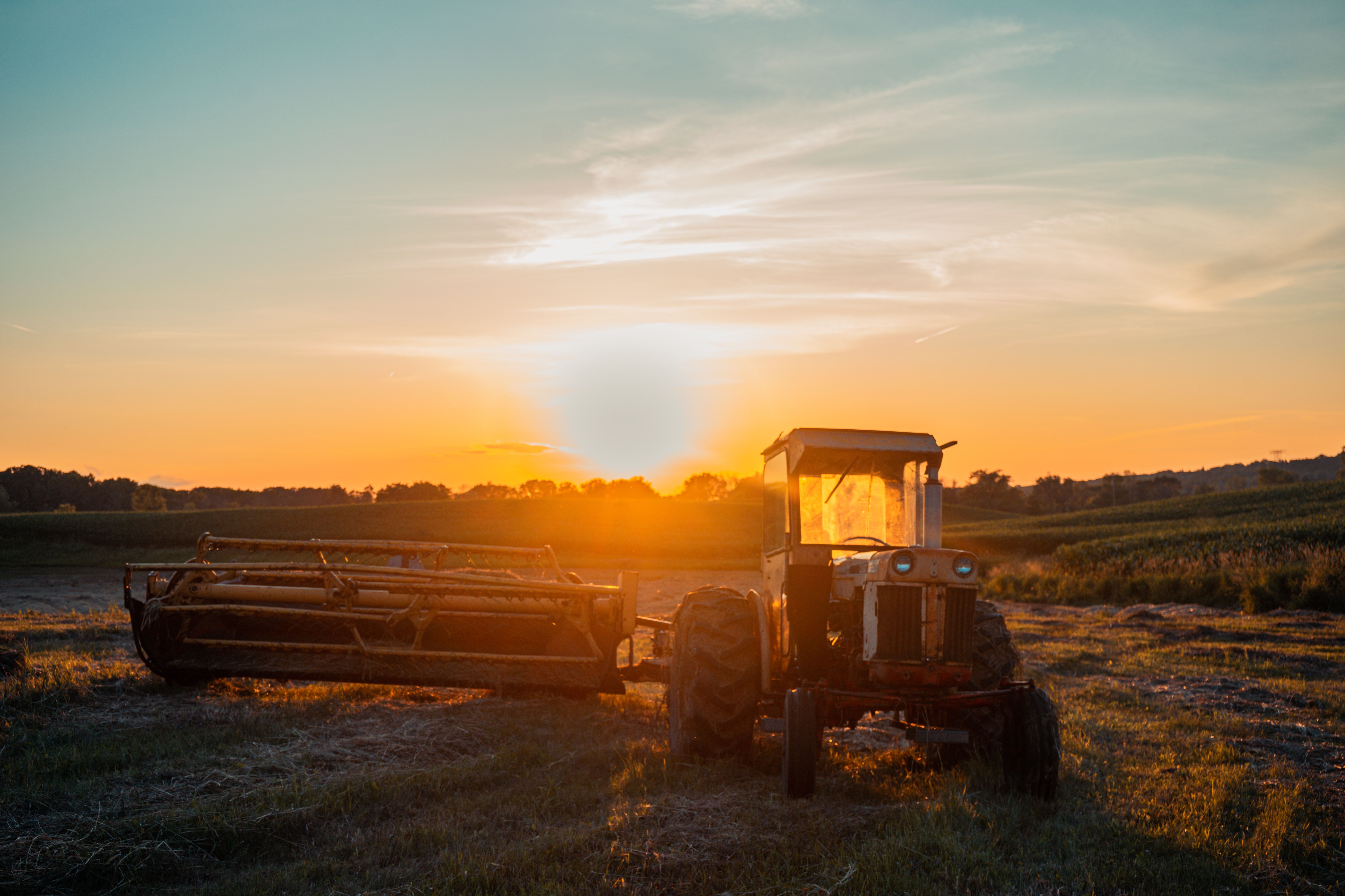 Silhouette Of Tractor On Field During Sunset · Free