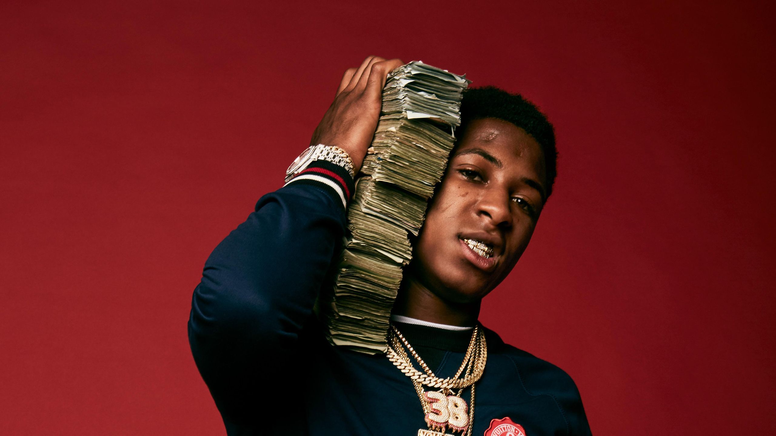 NBA Youngboy In Red Background With Money Bundle On Neck HD NBA Youngboy Wallpaper