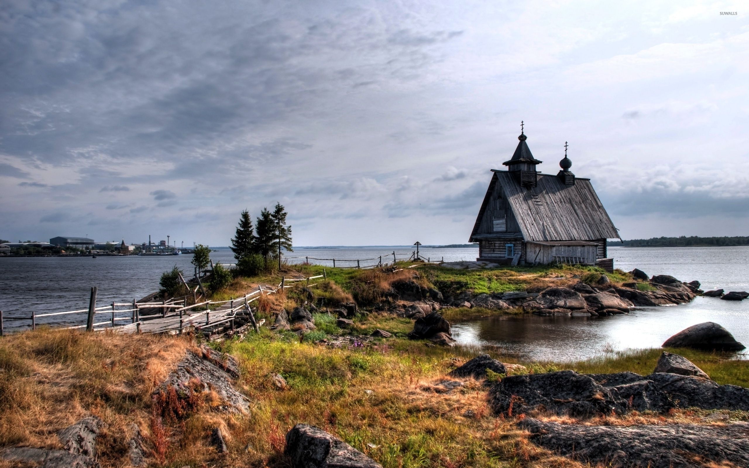 Old small house on the rocky river shore wallpaper wallpaper