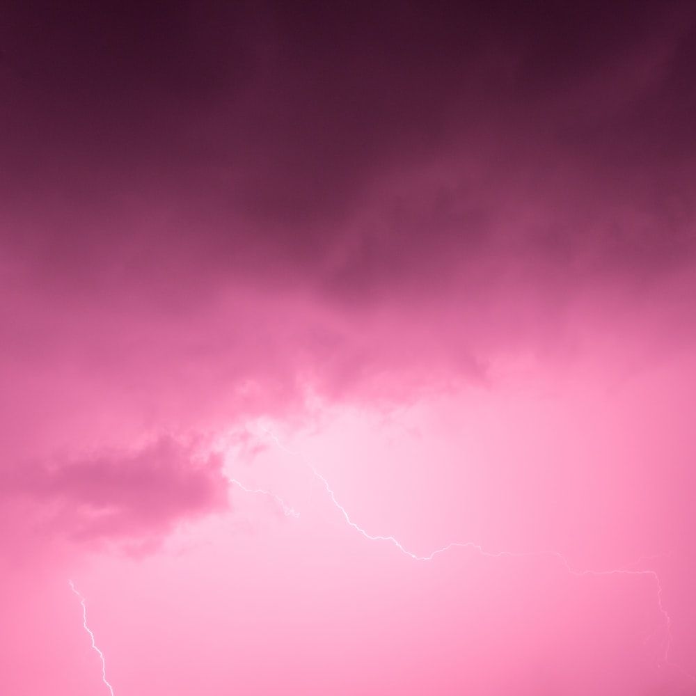 photography of pink cloud with thunder photo