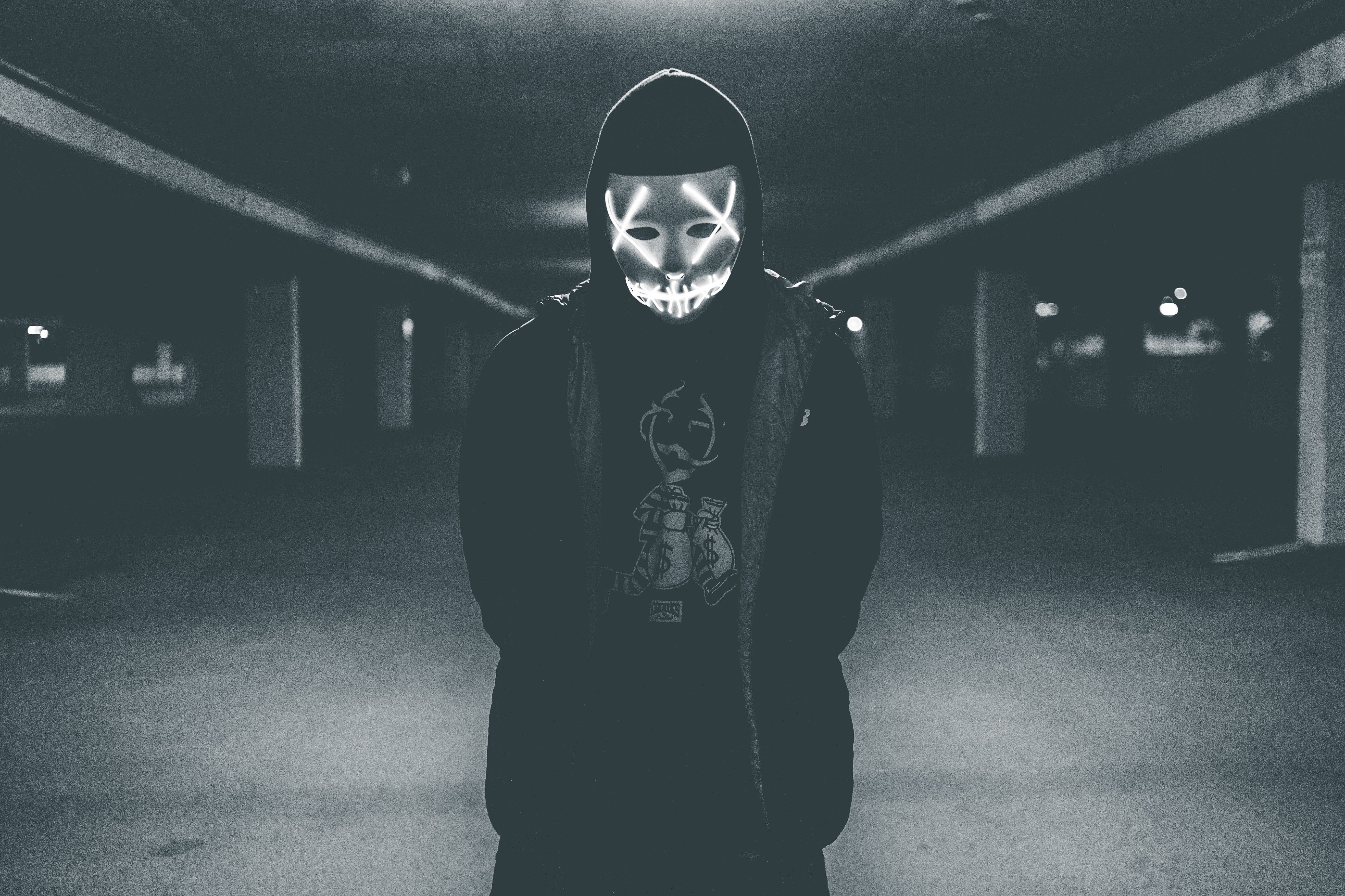 Man wearing hood and mask with neon lights · Free