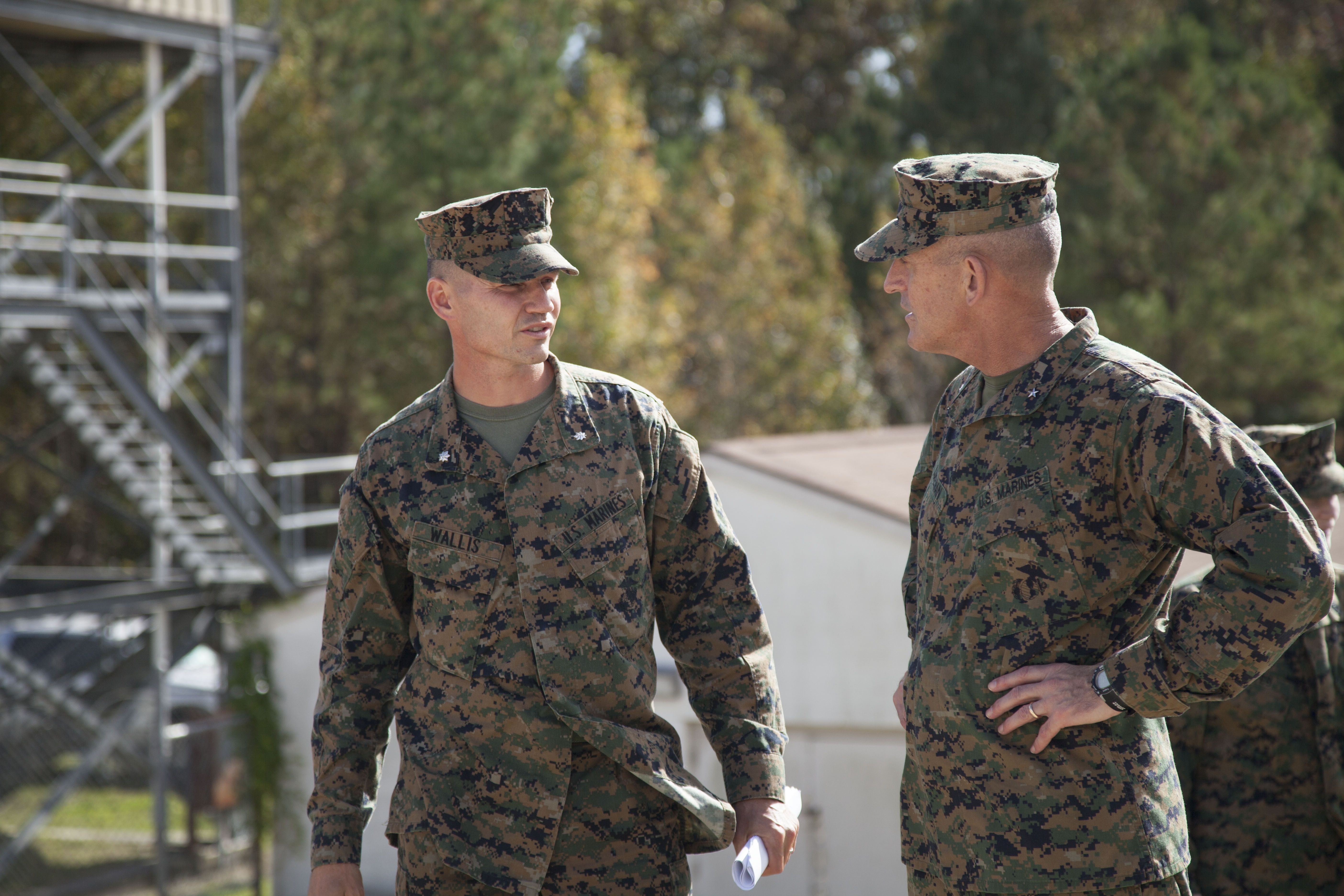 U.S. Marine Corps Lt. Col. David C. Wallis, commanding officer, Infantry Training Battalion talks to Brig. Gen. James W. Lukeman, commanding general, 2d Marine Division during his and Lt. Gen. Richard T