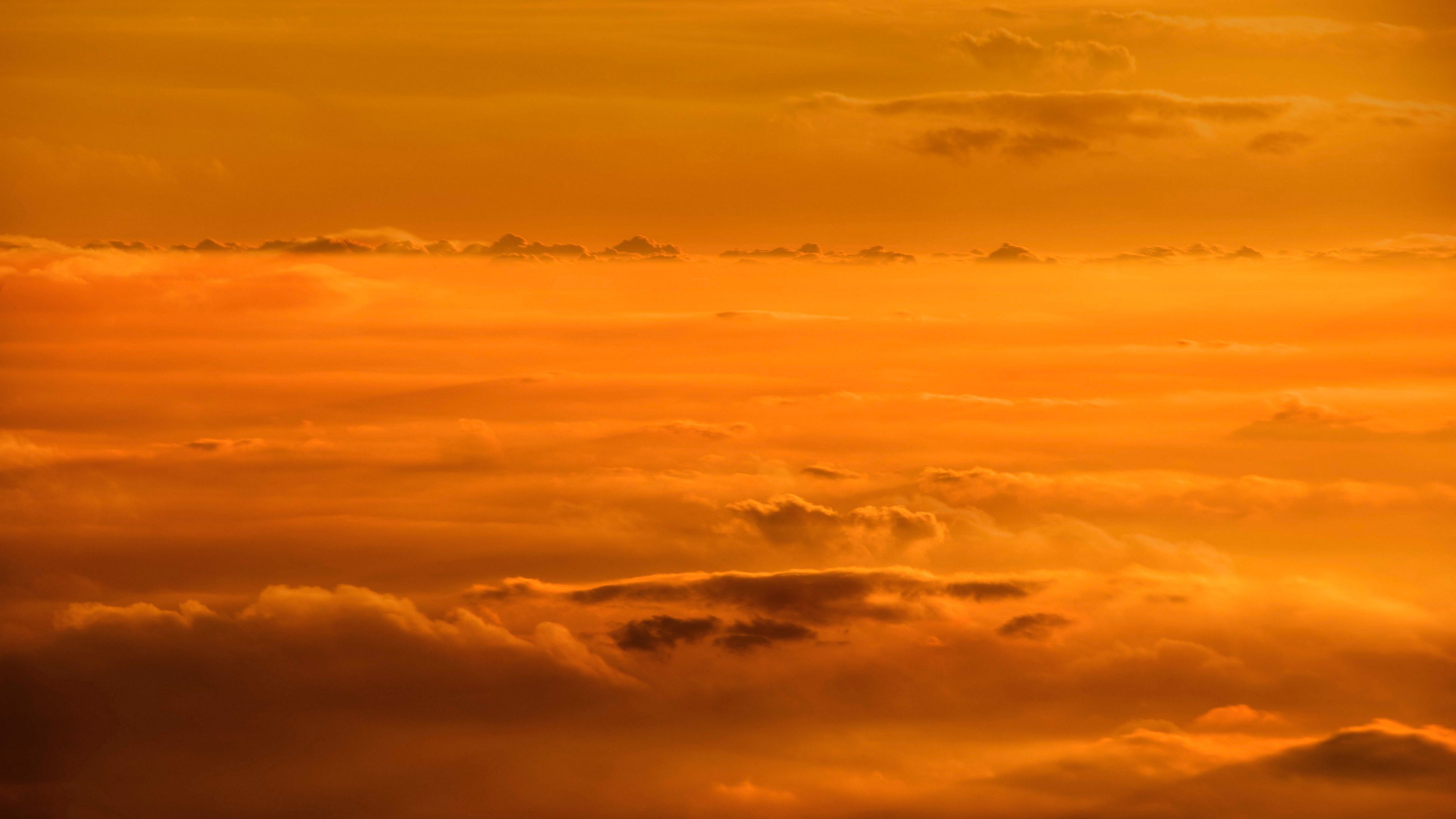 Download wallpaper 3840x2160 clouds, sky, sunset, yellow 4k uhd 16:9 HD background
