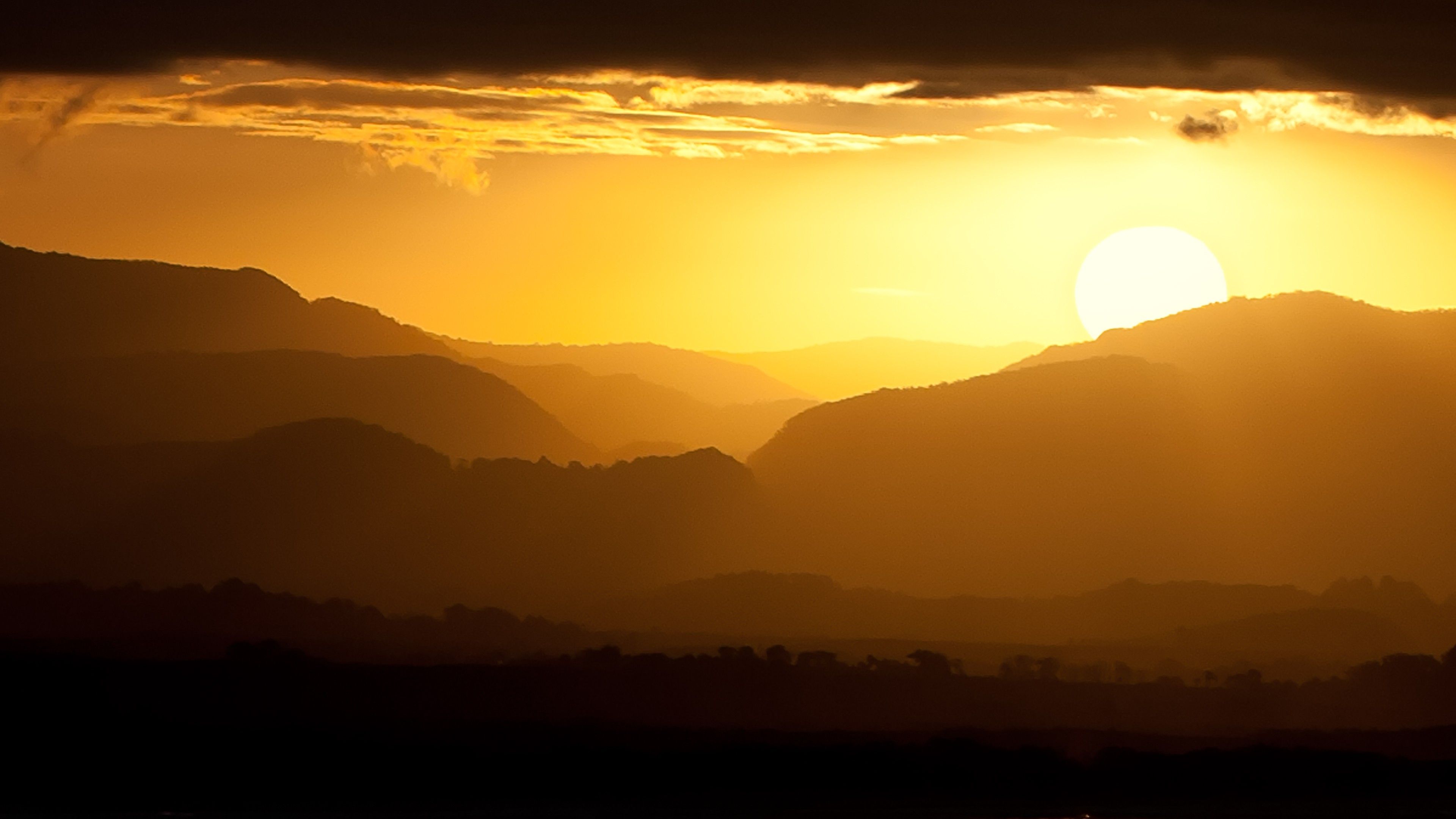 Sunset 4K Wallpaper, Landscape, Mountains, Yellow sky, Silhouette, Nature