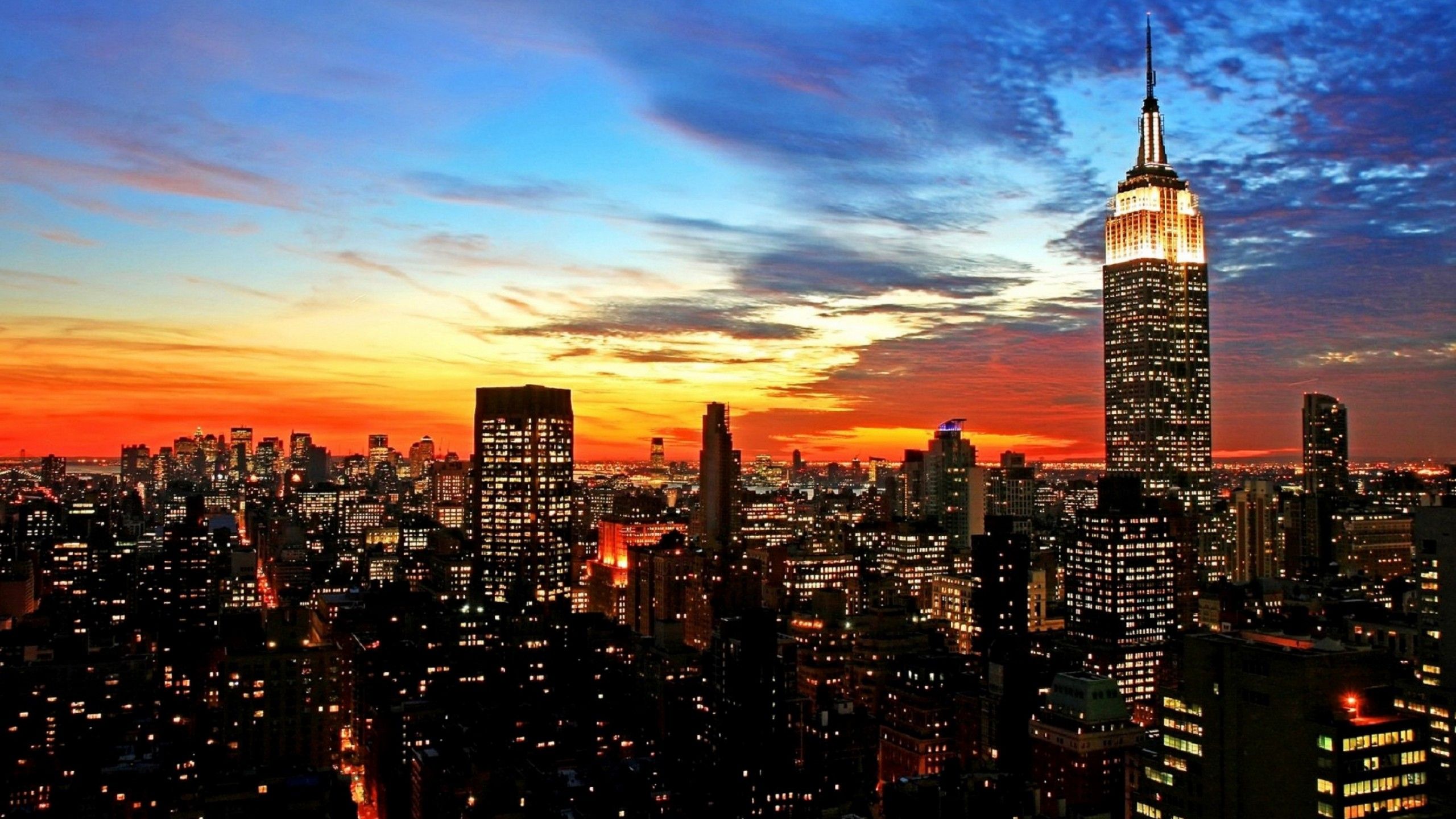 City Manhattan With Background Of Blue And Yellow Sky During Sunset 4K HD New York Wallpaper